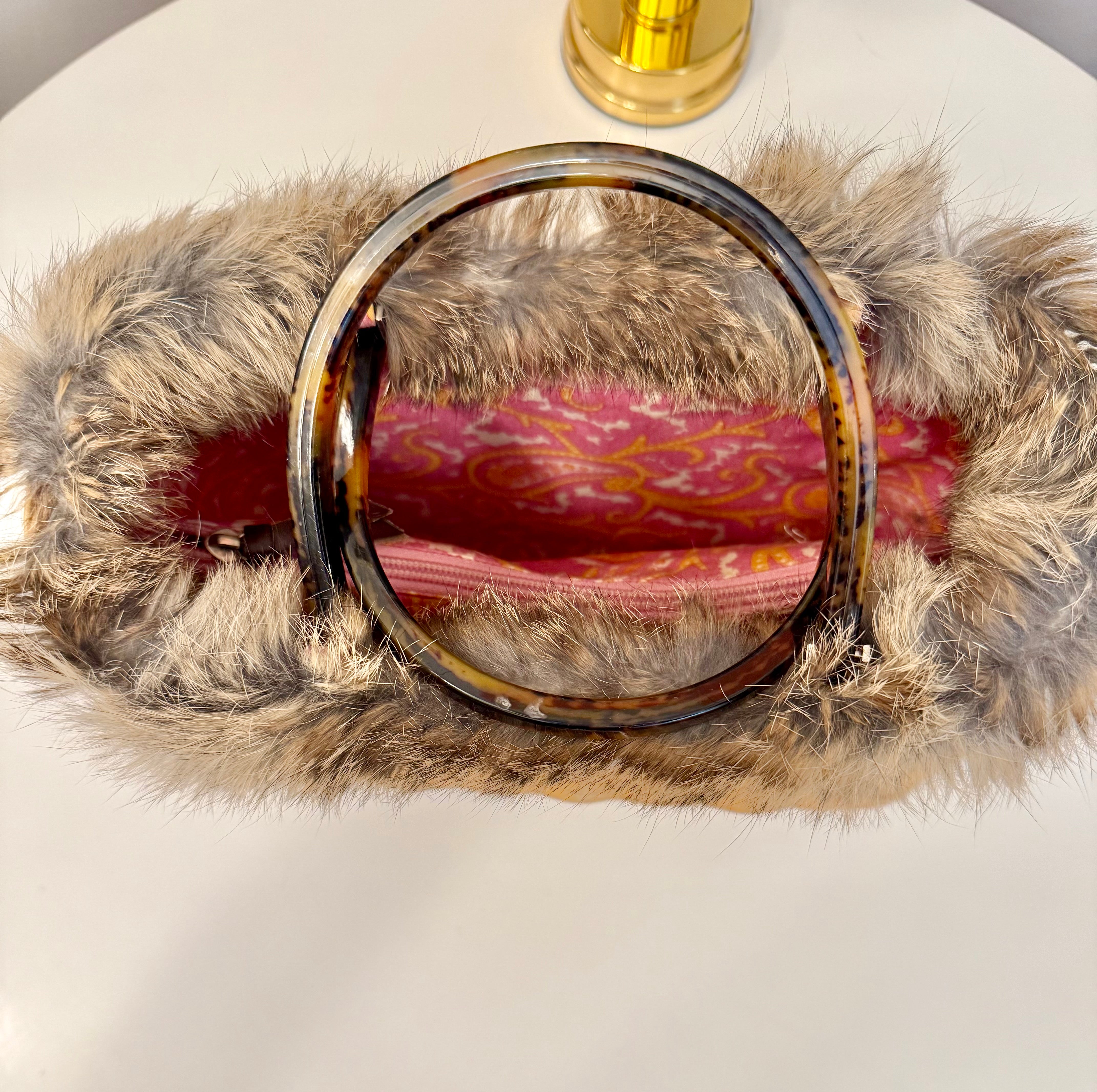 The most darling Kate Spade basket bag trimmed with fox fur....