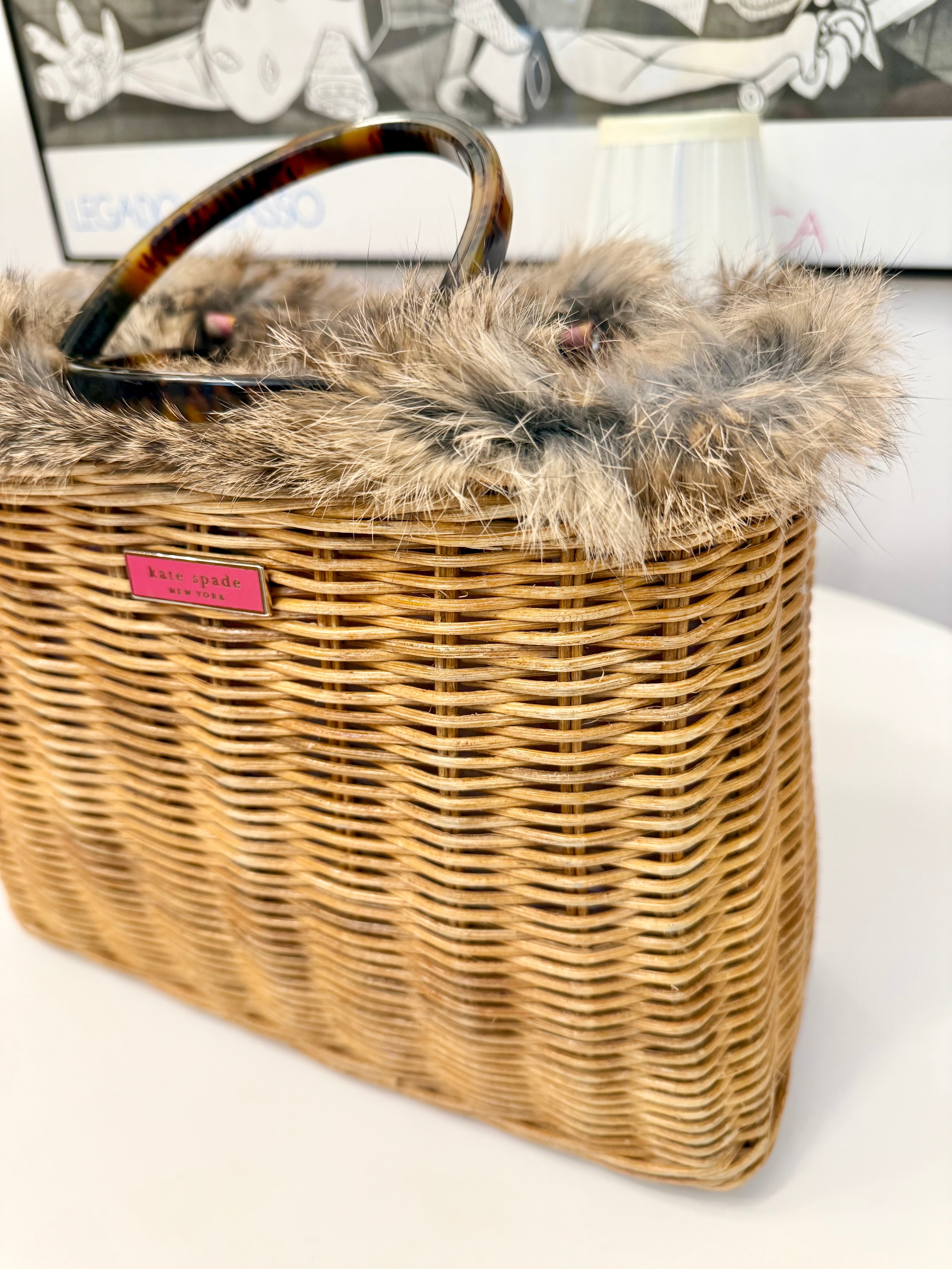 The most darling Kate Spade basket bag trimmed with fox fur....
