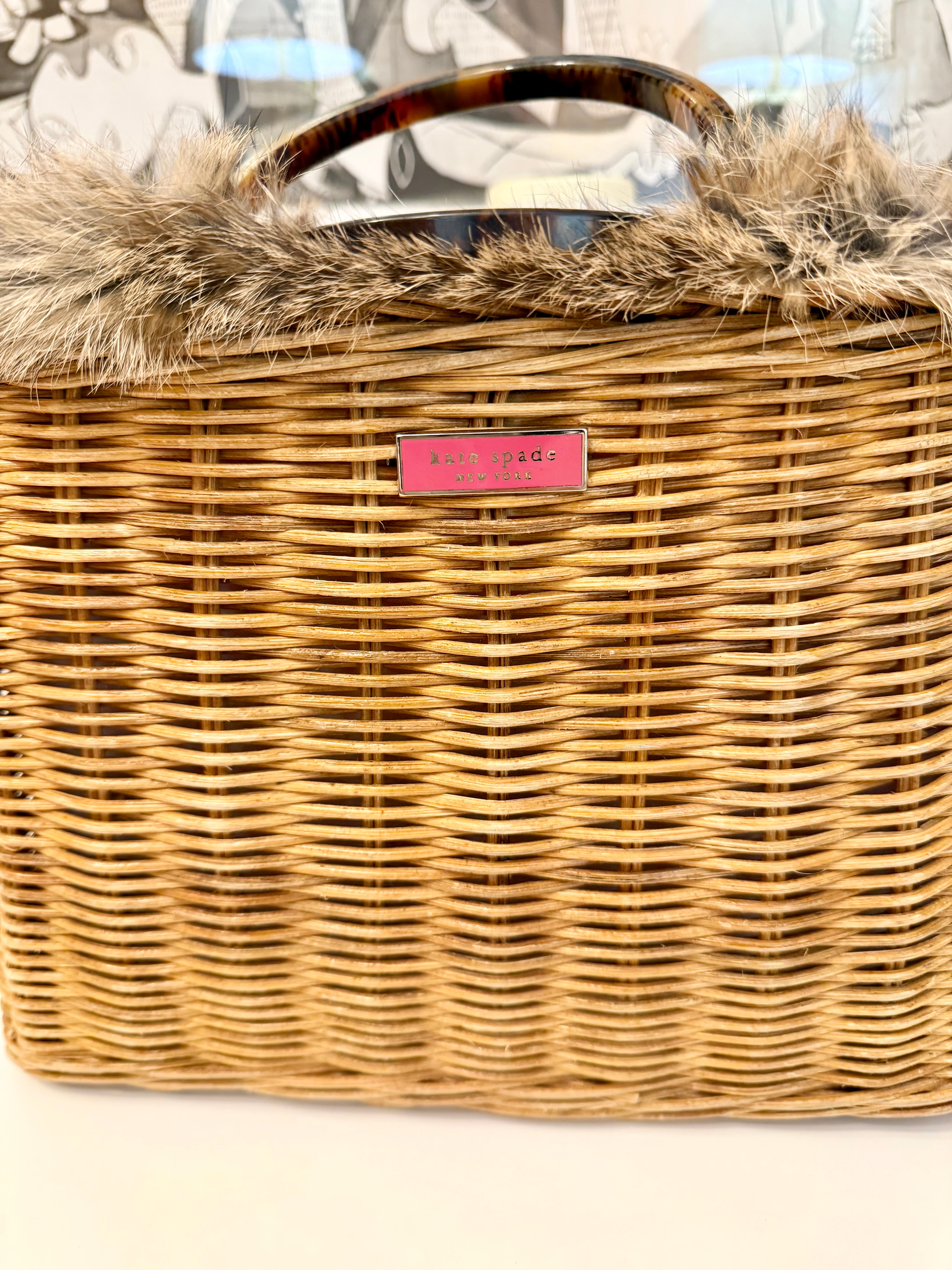 The most darling Kate Spade basket bag trimmed with fox fur....