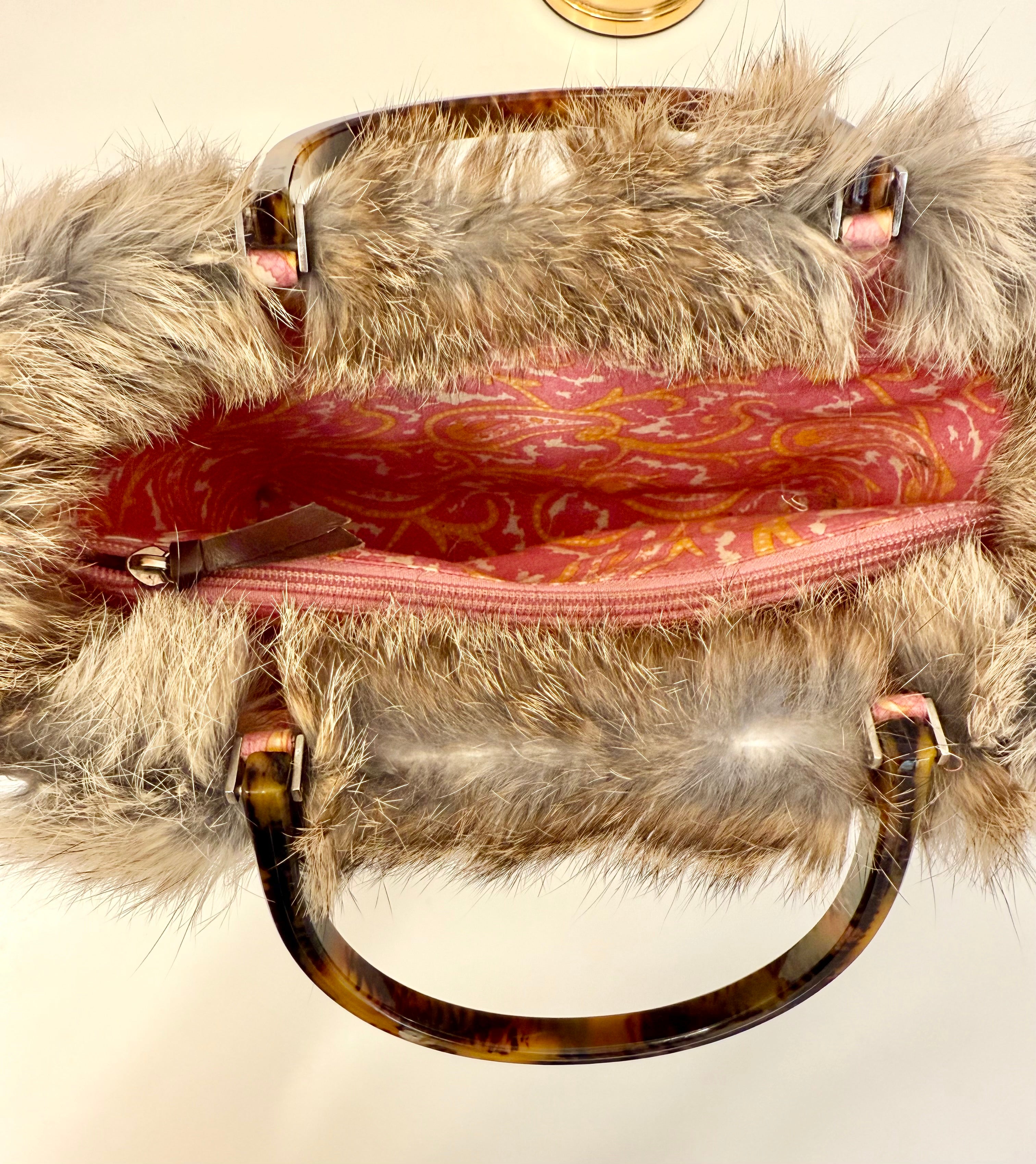 The most darling Kate Spade basket bag trimmed with fox fur....