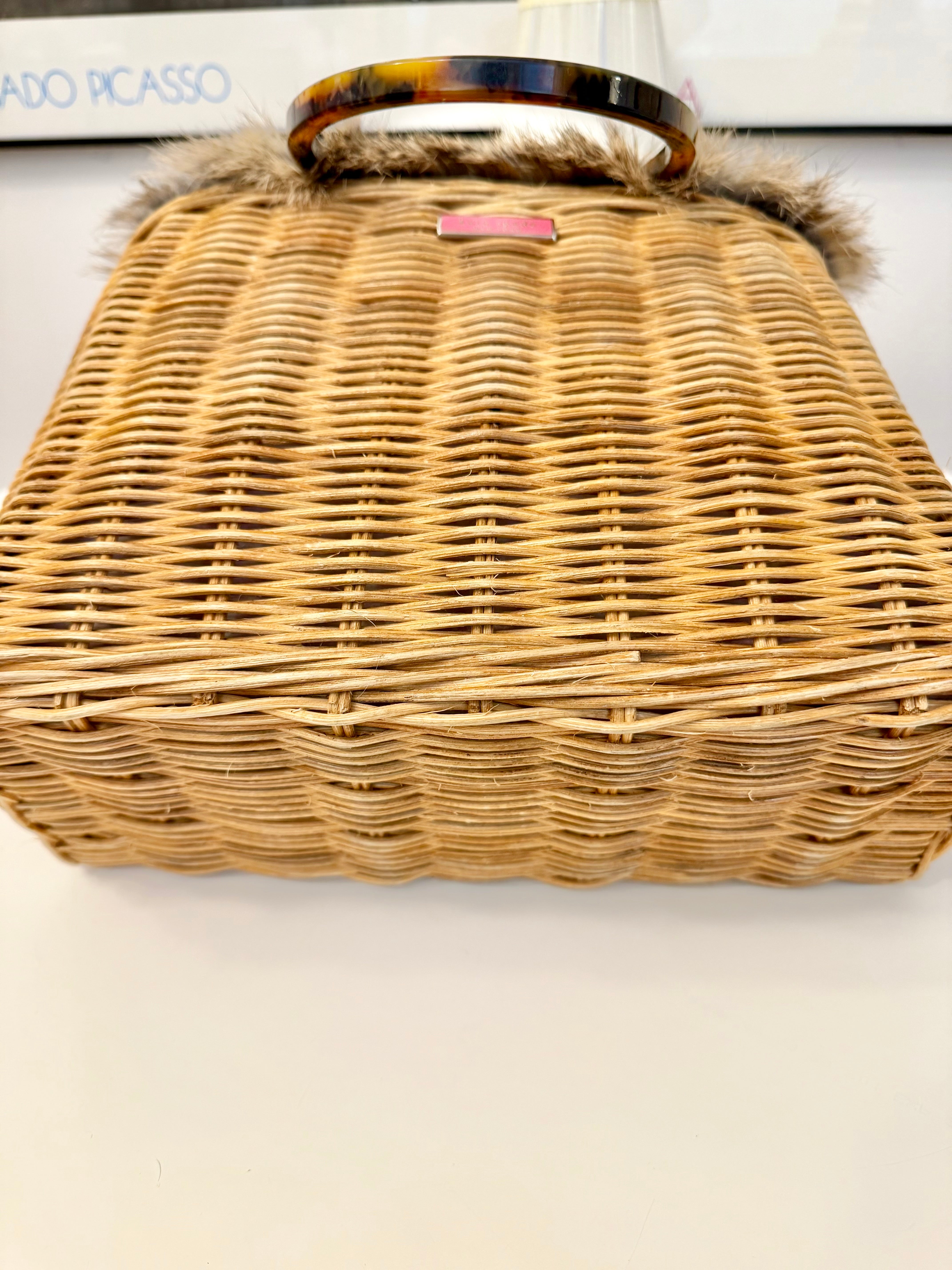 The most darling Kate Spade basket bag trimmed with fox fur....
