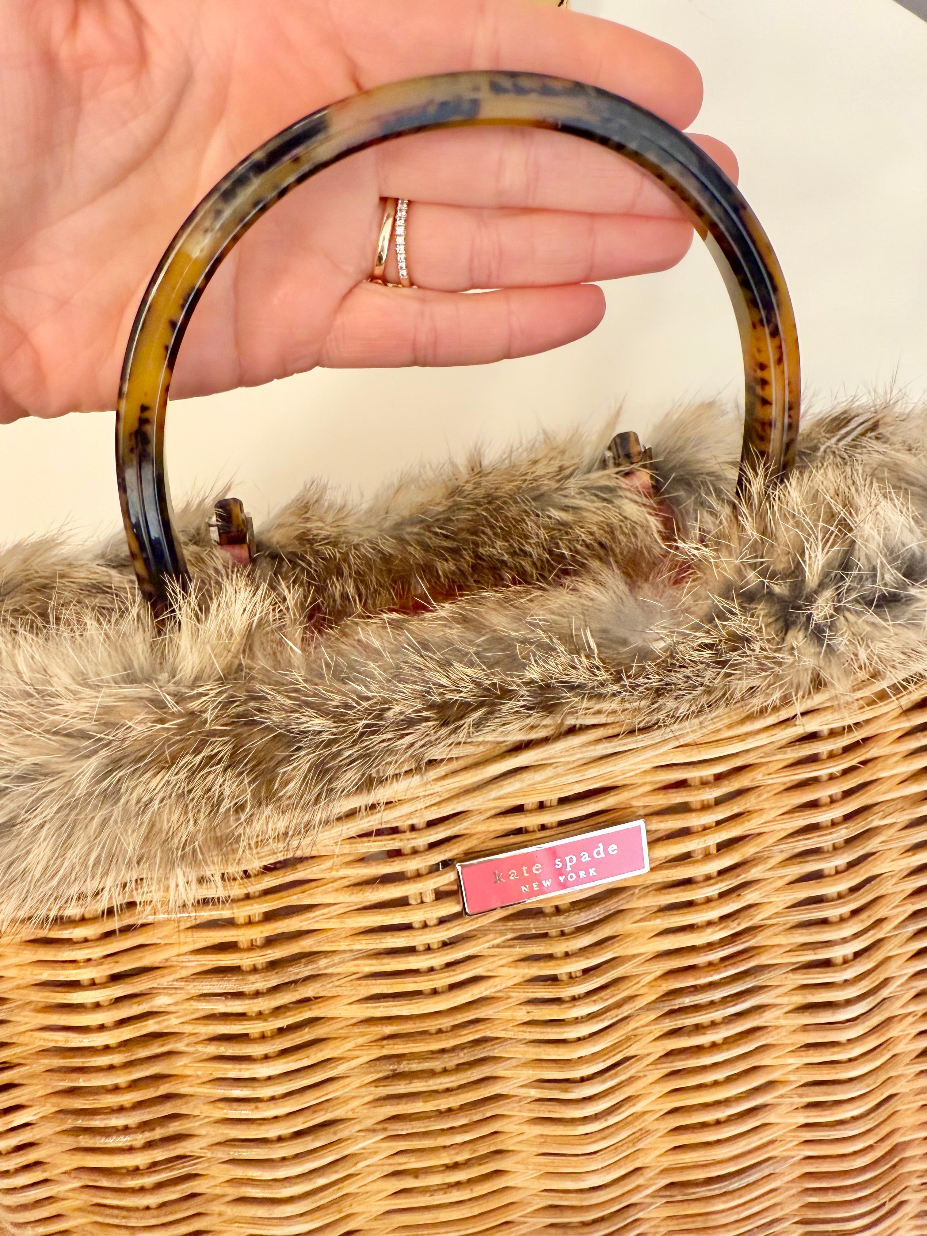 The most darling Kate Spade basket bag trimmed with fox fur....
