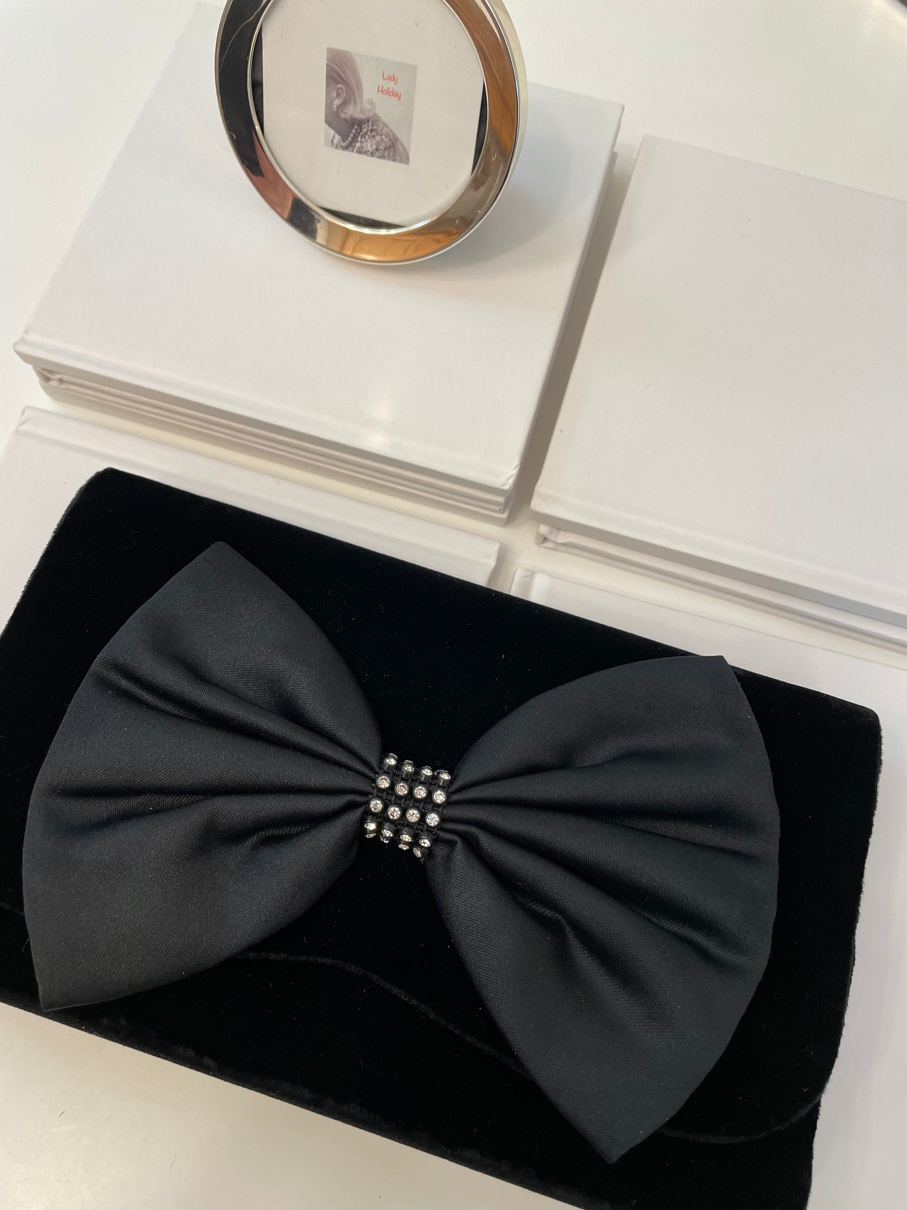 A truly preppy large bow noir velvet evening bag....so classy