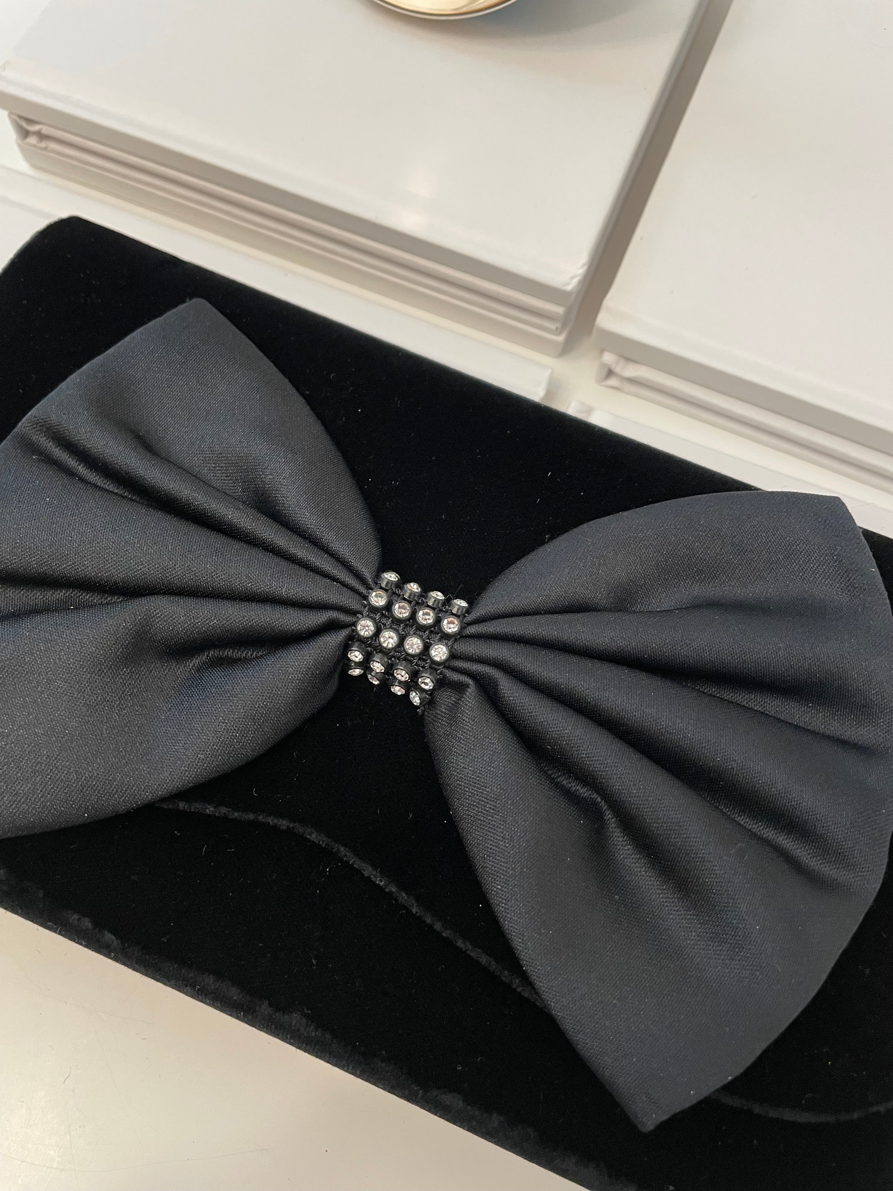 A truly preppy large bow noir velvet evening bag....so classy