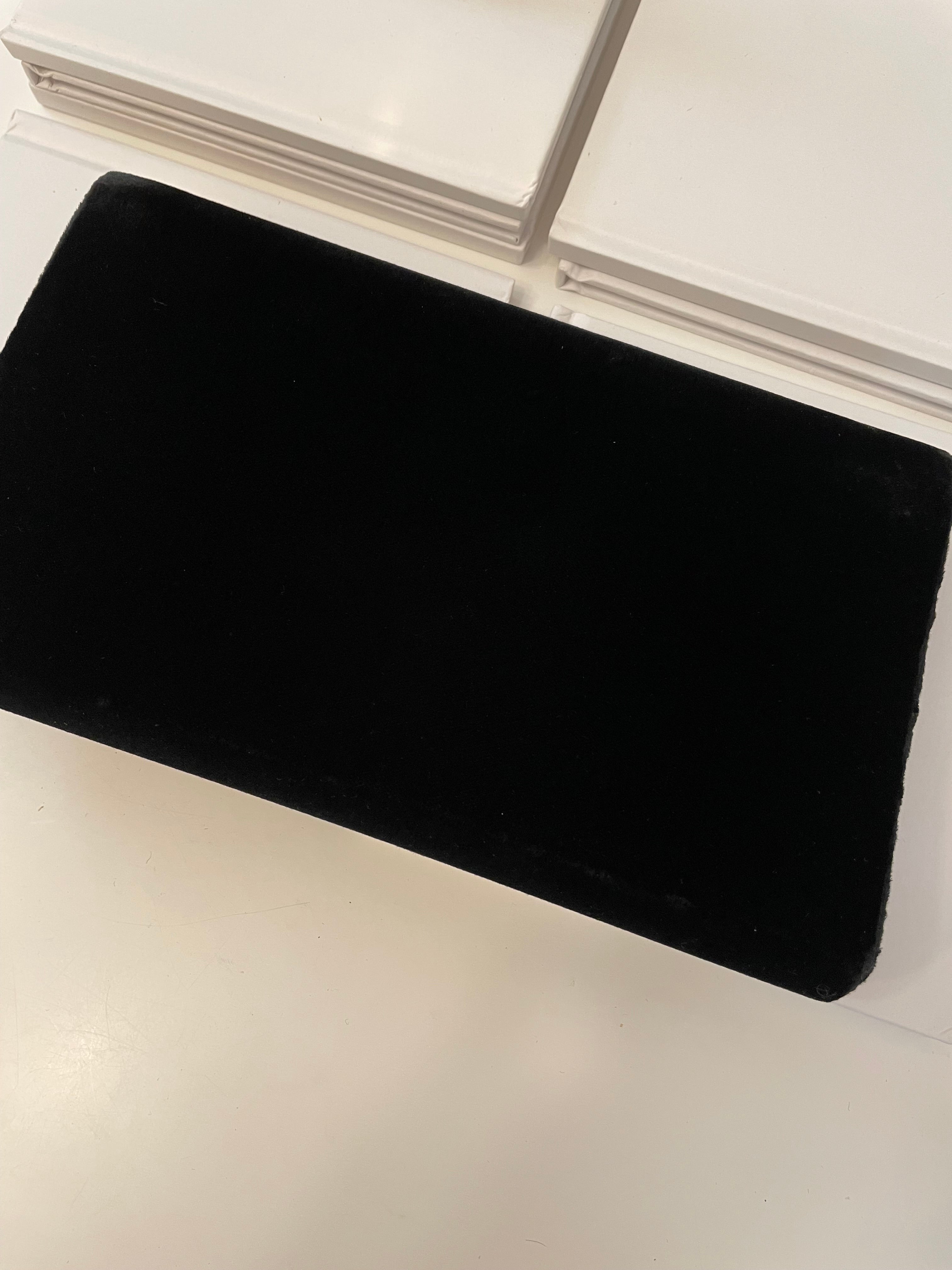 A truly preppy large bow noir velvet evening bag....so classy