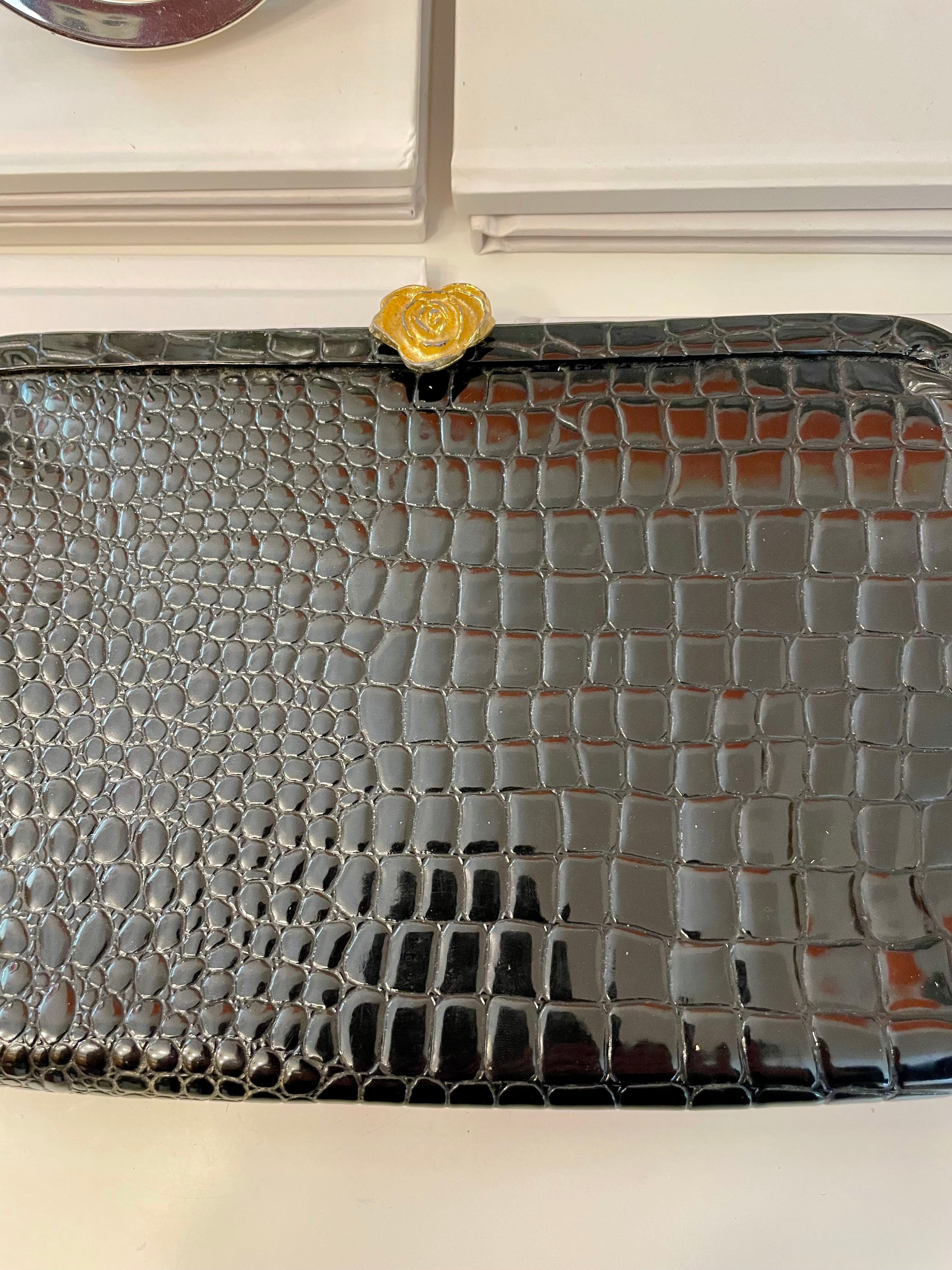 The Socialite and her love of the classy, and the timeless! This faux croco clutch bag is truly divine.