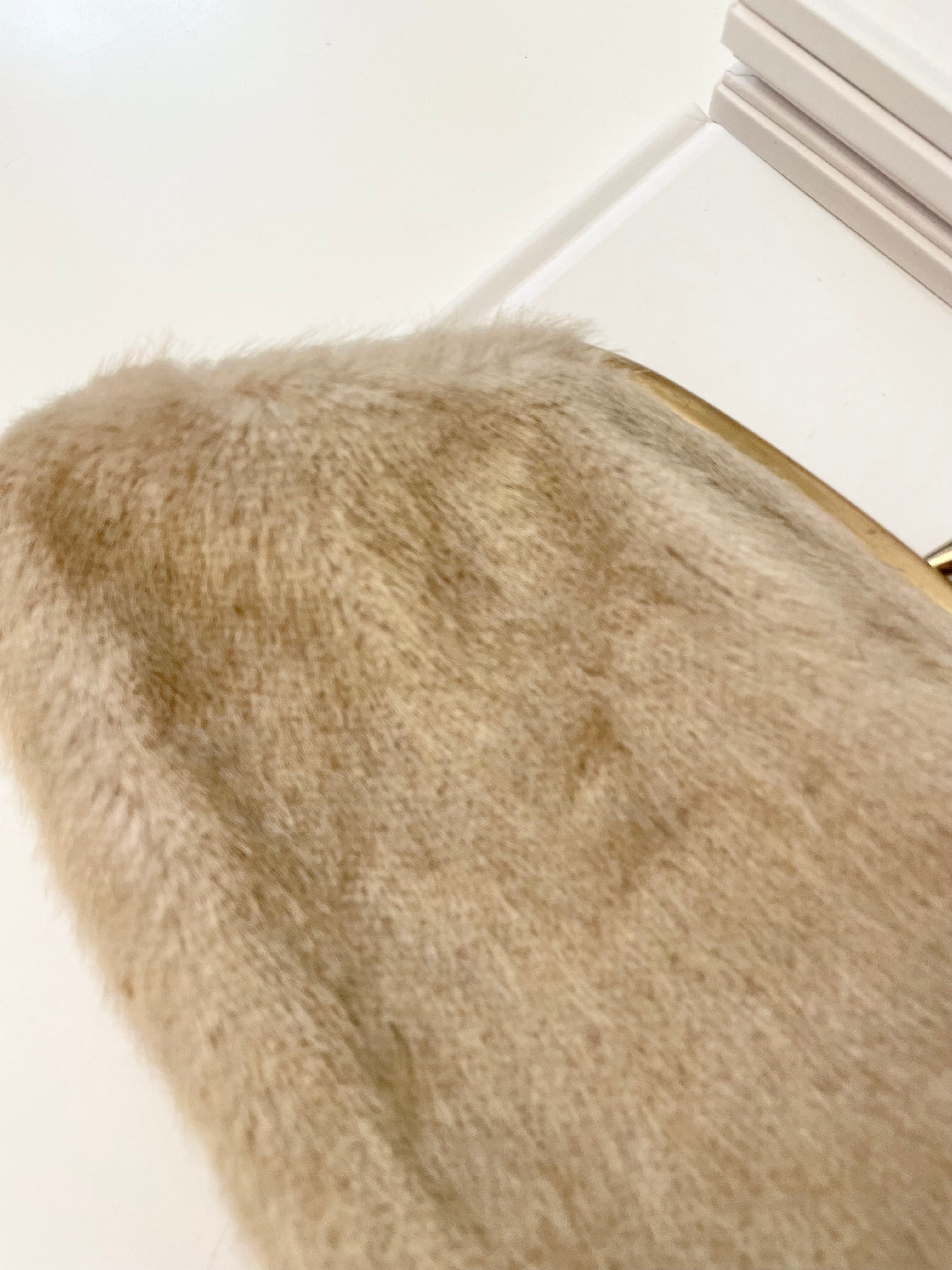 The 1960's Heiress loves a faux mink clutch bag!