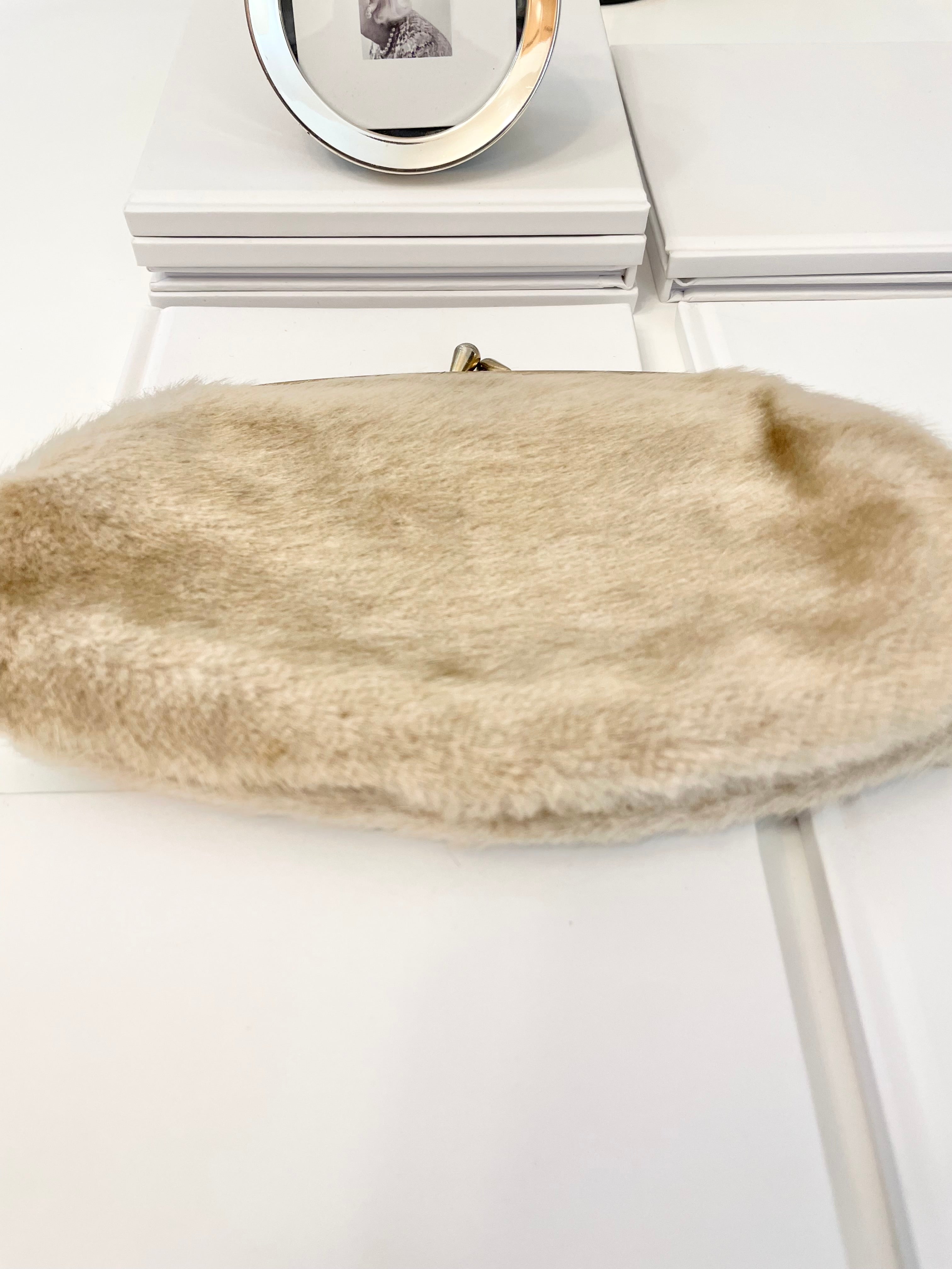 The 1960's Heiress loves a faux mink clutch bag!
