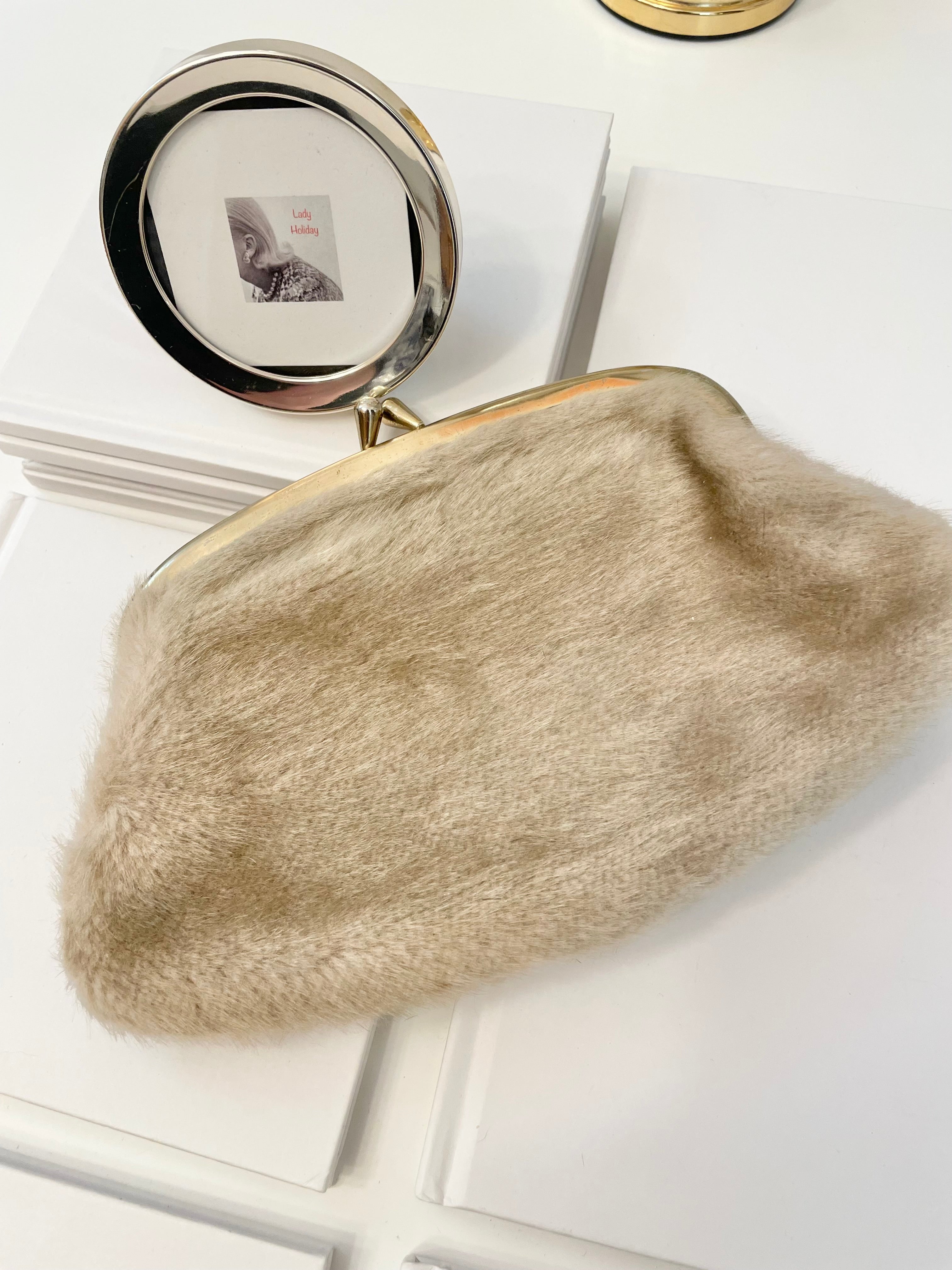 The 1960's Heiress loves a faux mink clutch bag!