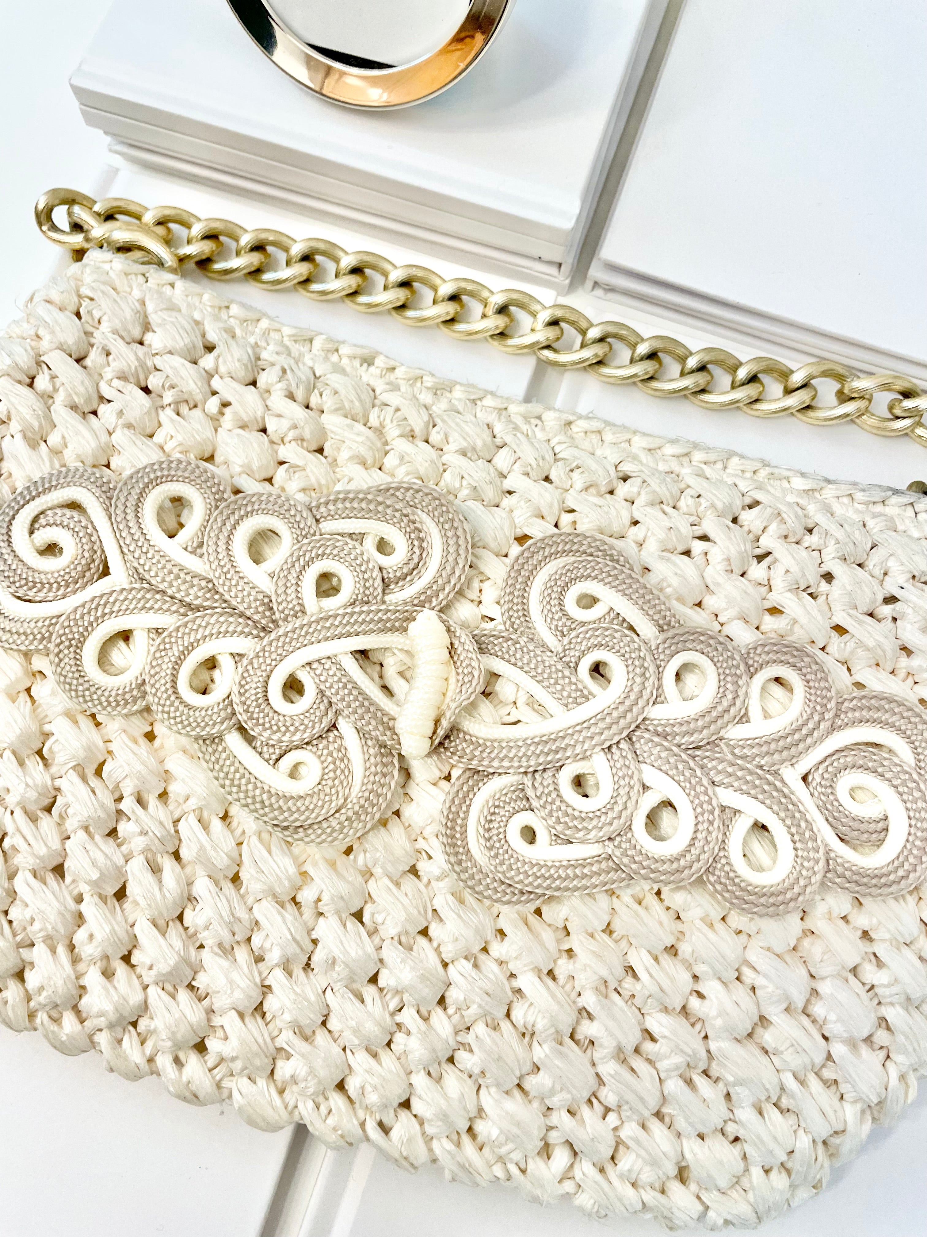 Vintage super sassy 1960's ivory straw bag with a classy gold chain... so elegant.
