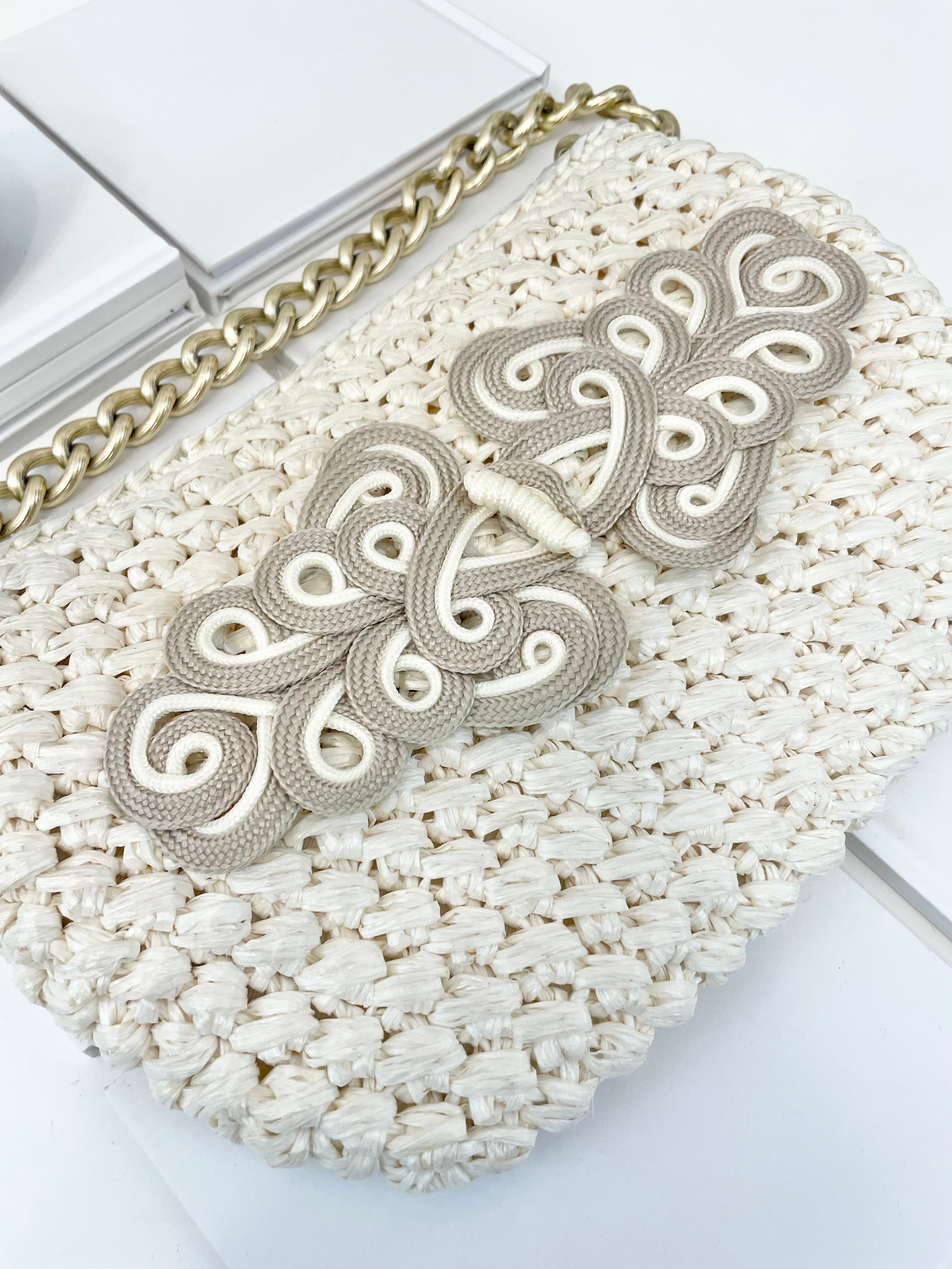 Vintage super sassy 1960's ivory straw bag with a classy gold chain... so elegant.