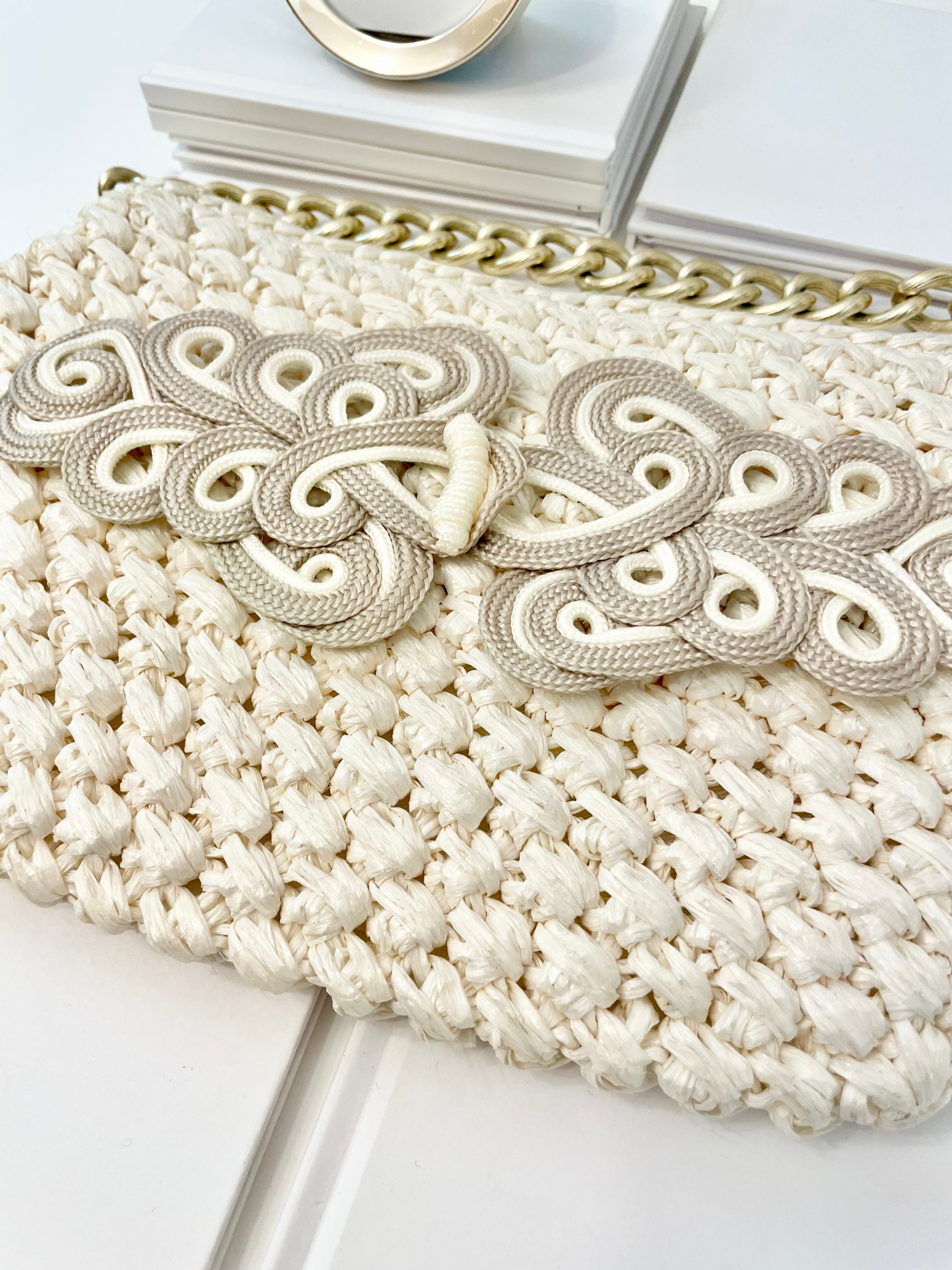 Vintage super sassy 1960's ivory straw bag with a classy gold chain... so elegant.