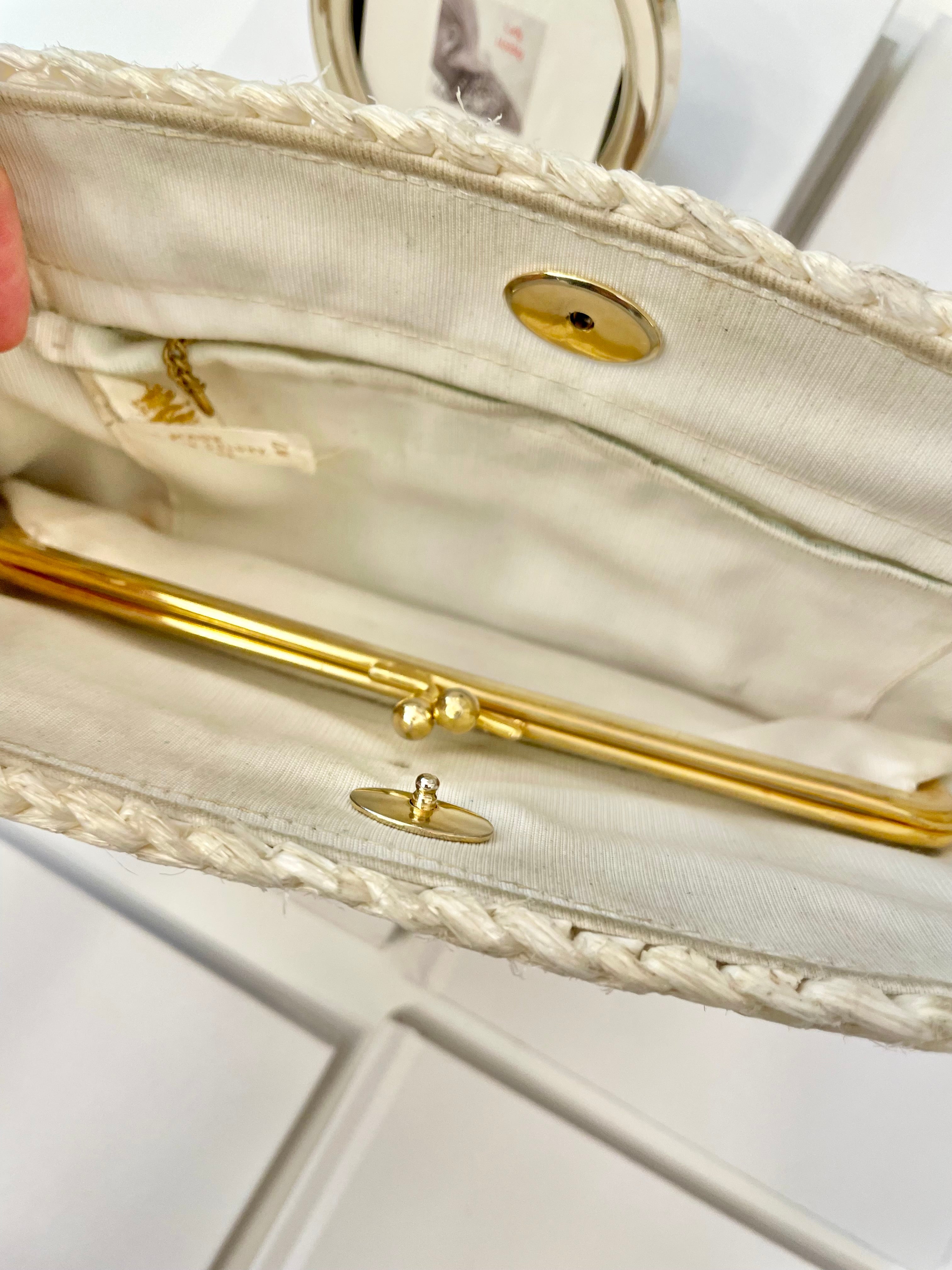 Vintage super sassy 1960's ivory straw bag with a classy gold chain... so elegant.