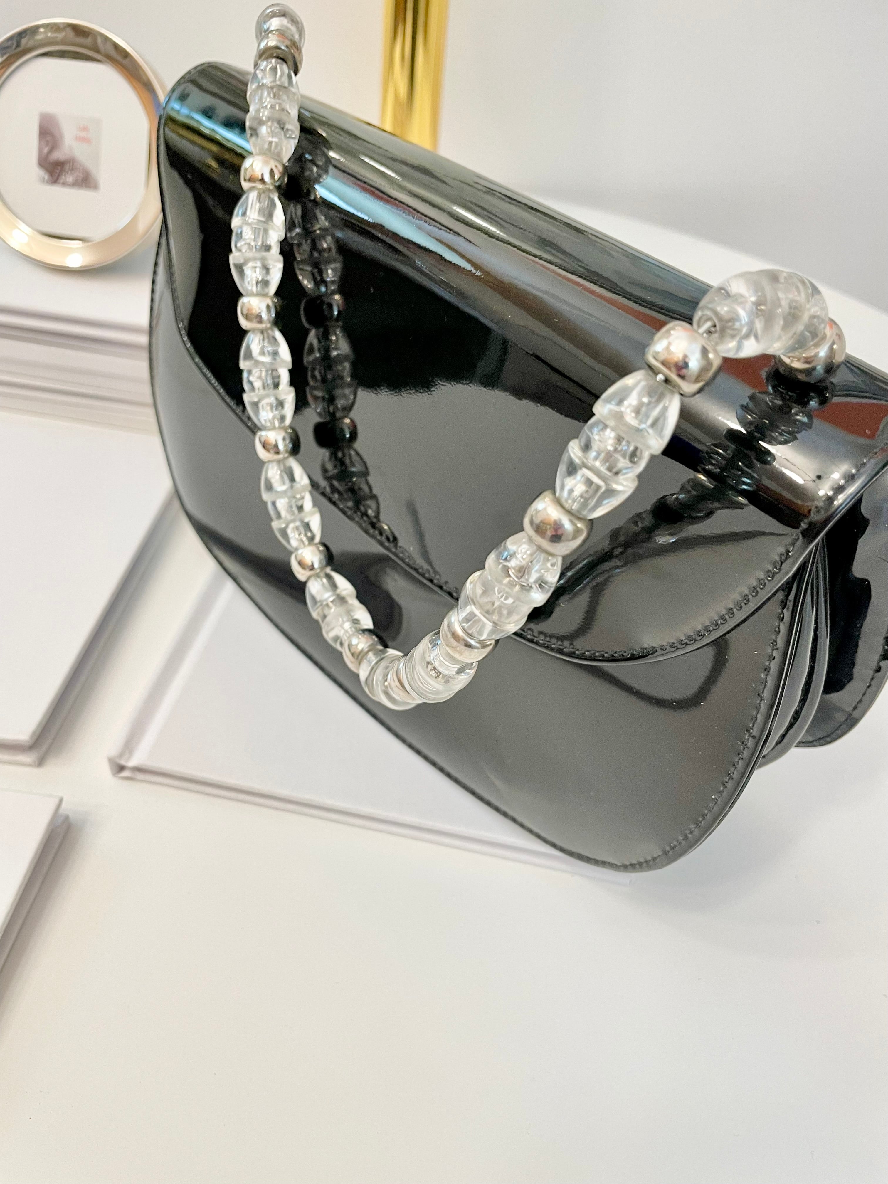 Truly classic faux patent leather, and lucite handle ladies purse... so classy!