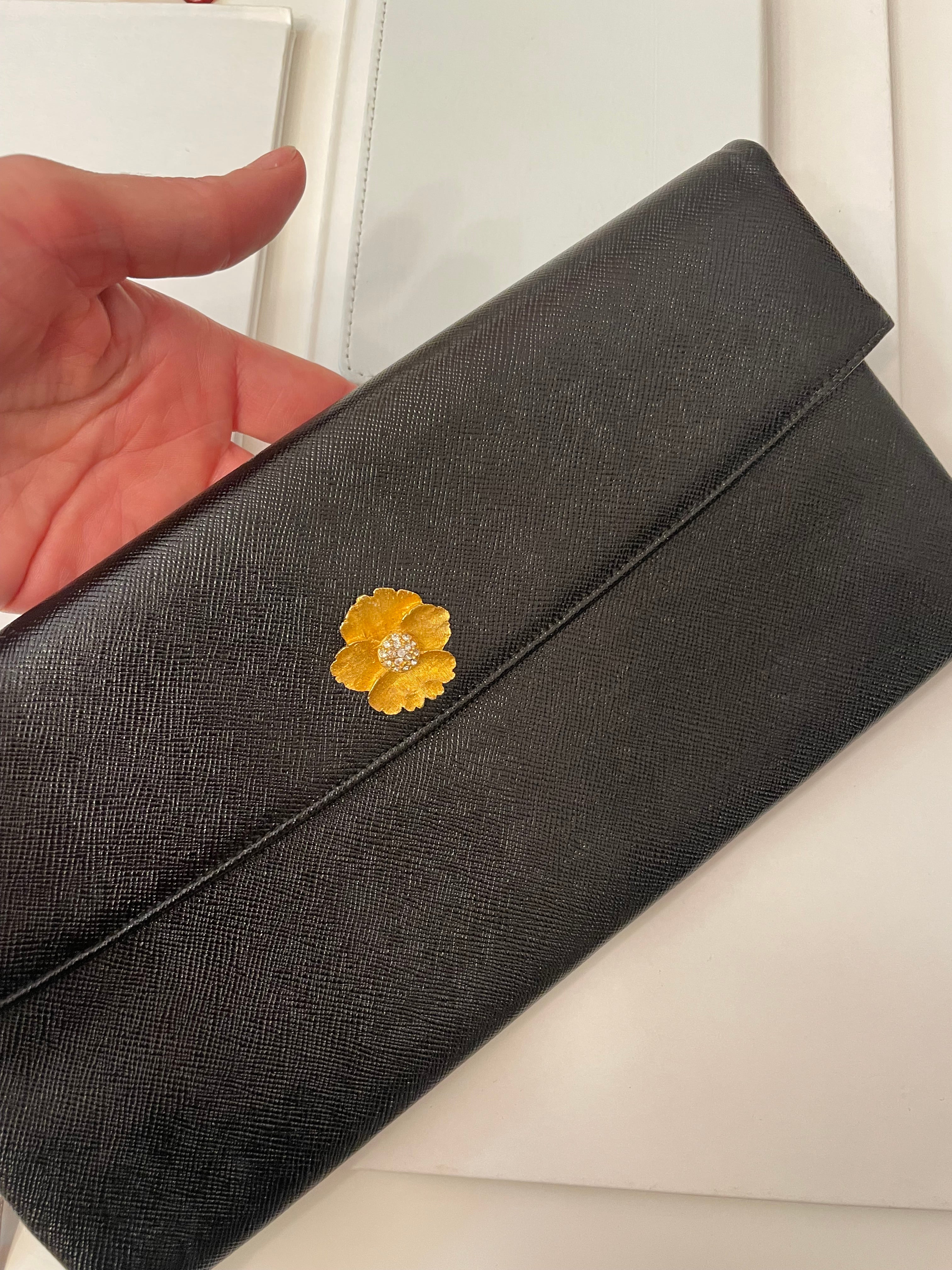 Vintage 1960's Prestige noir clutch bag for Saks Fifth Avenue, adorned with chic gold flower..so lady like!