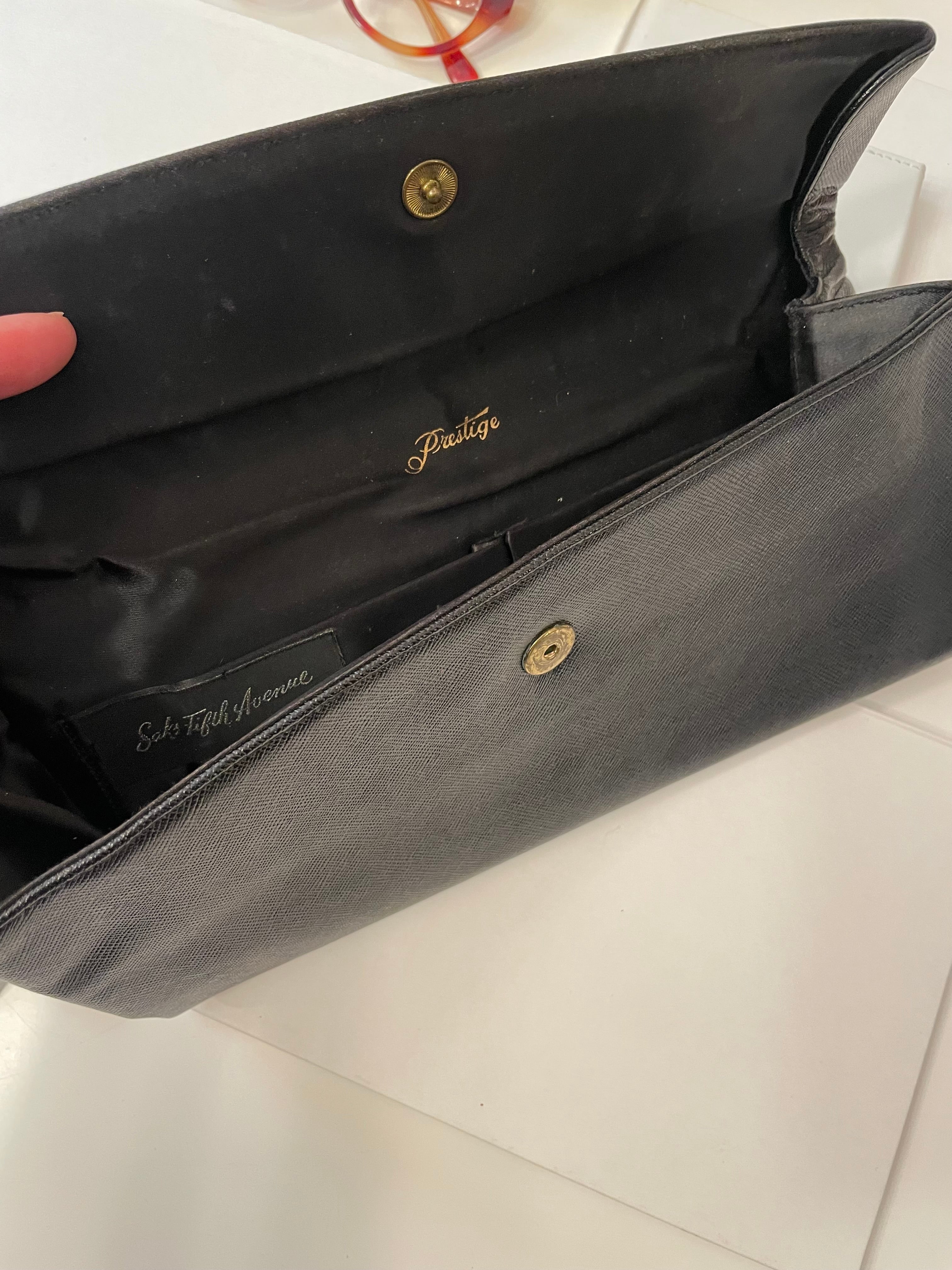 Vintage 1960's Prestige noir clutch bag for Saks Fifth Avenue, adorned with chic gold flower..so lady like!