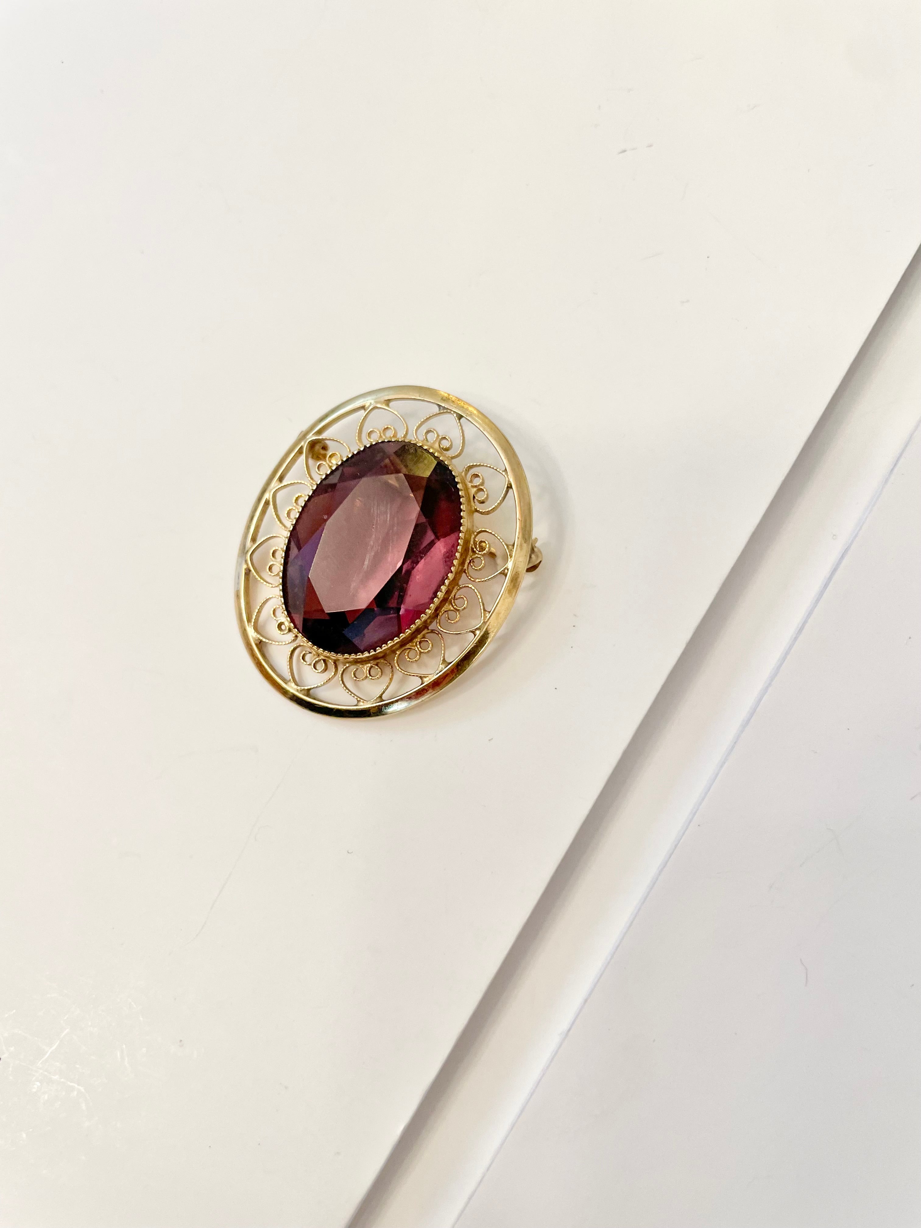 1950's gold genuine amethyst elegant brooch.... so lovely.