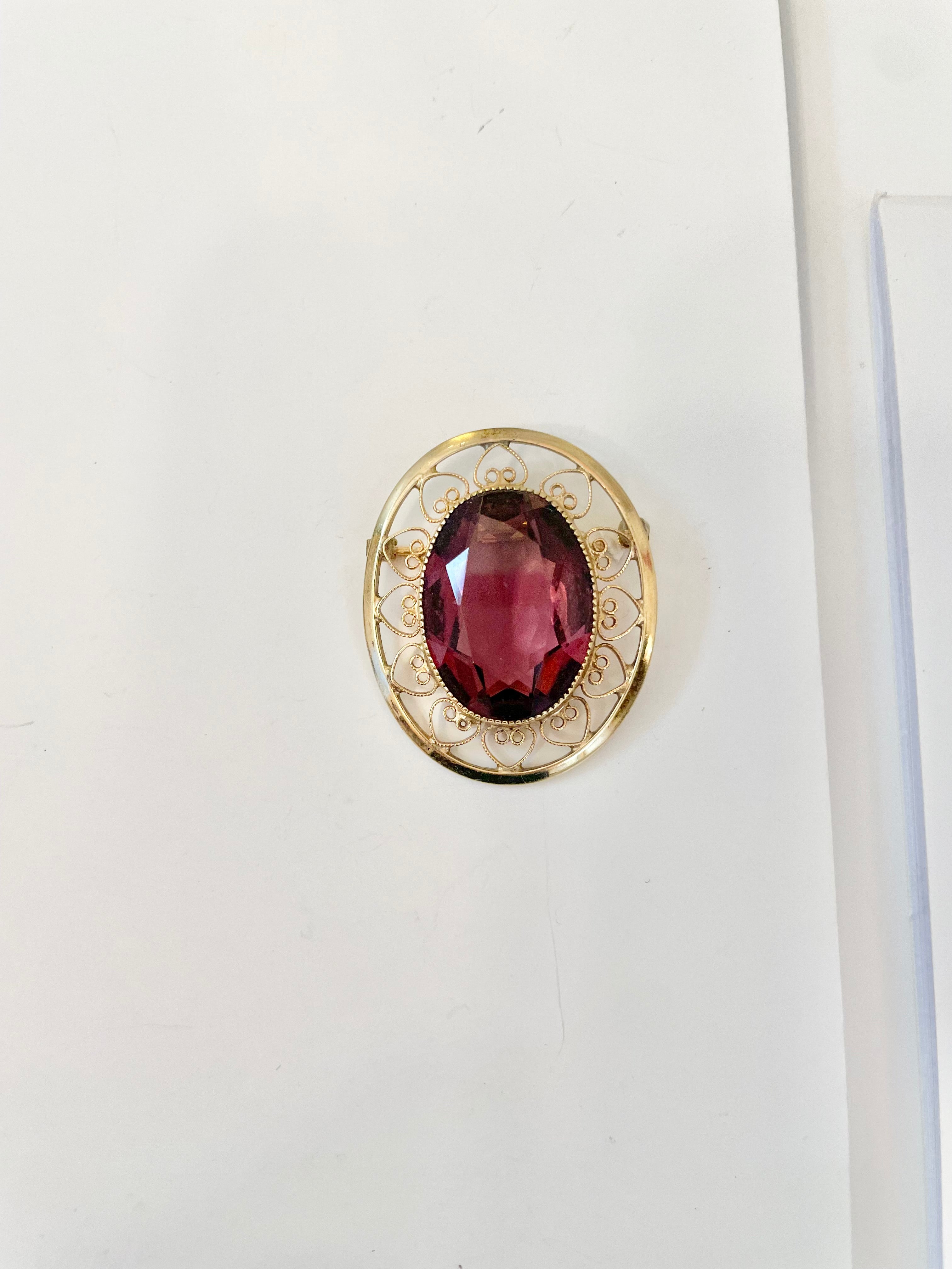 1950's gold genuine amethyst elegant brooch.... so lovely.