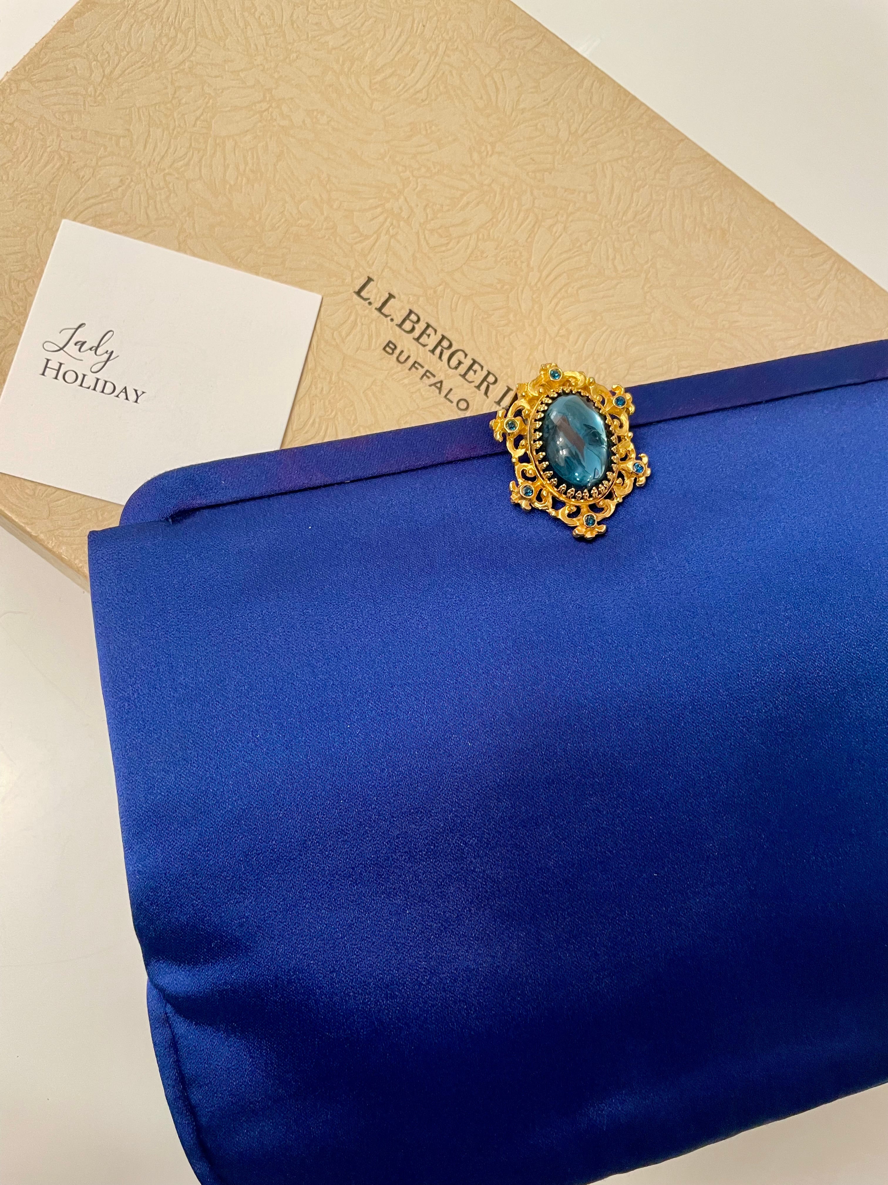 Glamorous and chic, 1960's vintage rich royal blue satin clutch bag, with stunning closure...so elegant