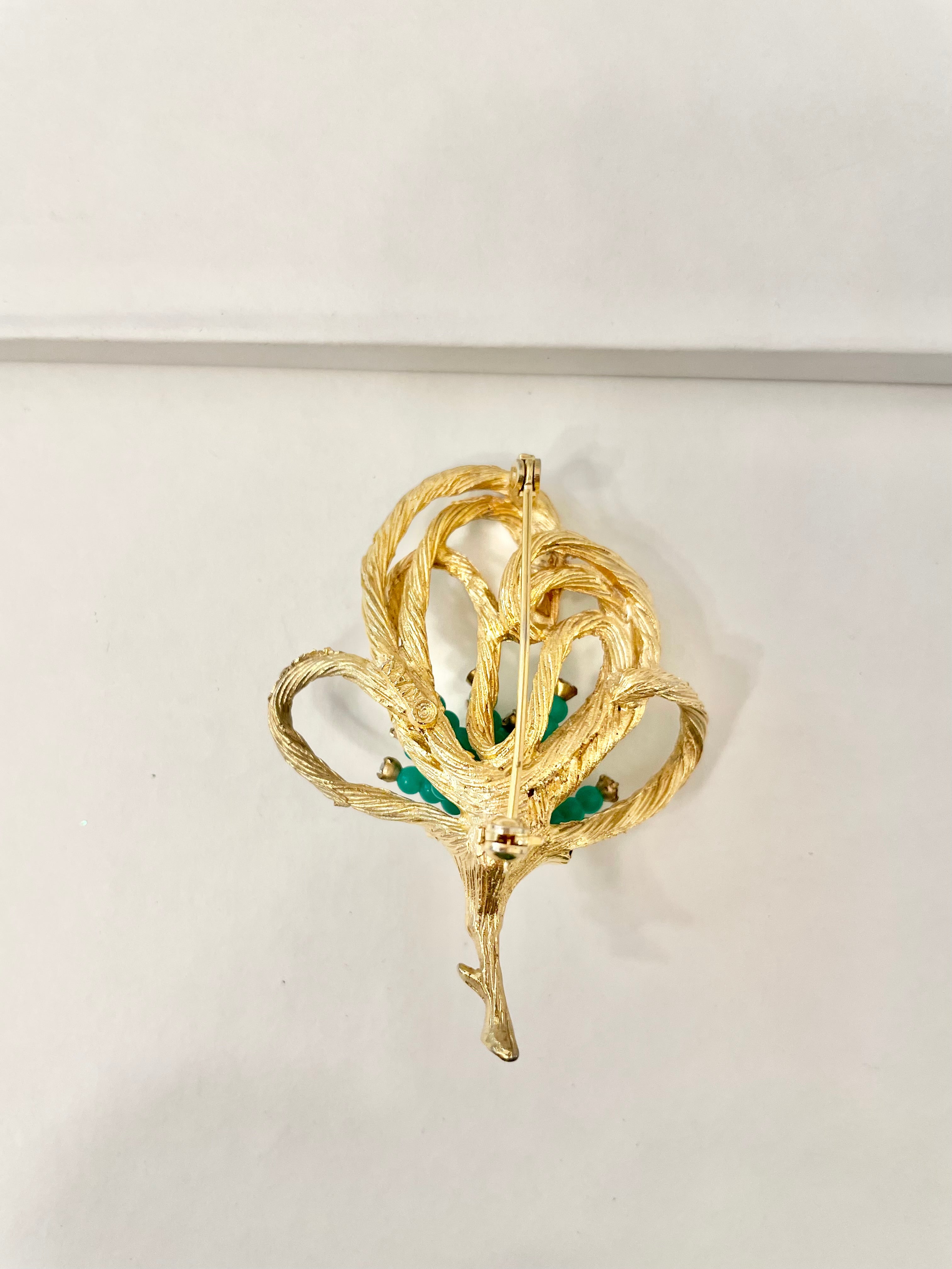 A truly classic brooch for a classy lady... love this bottle green beaded brooch with a sprig of clear glass stones, set in gold! so lovely