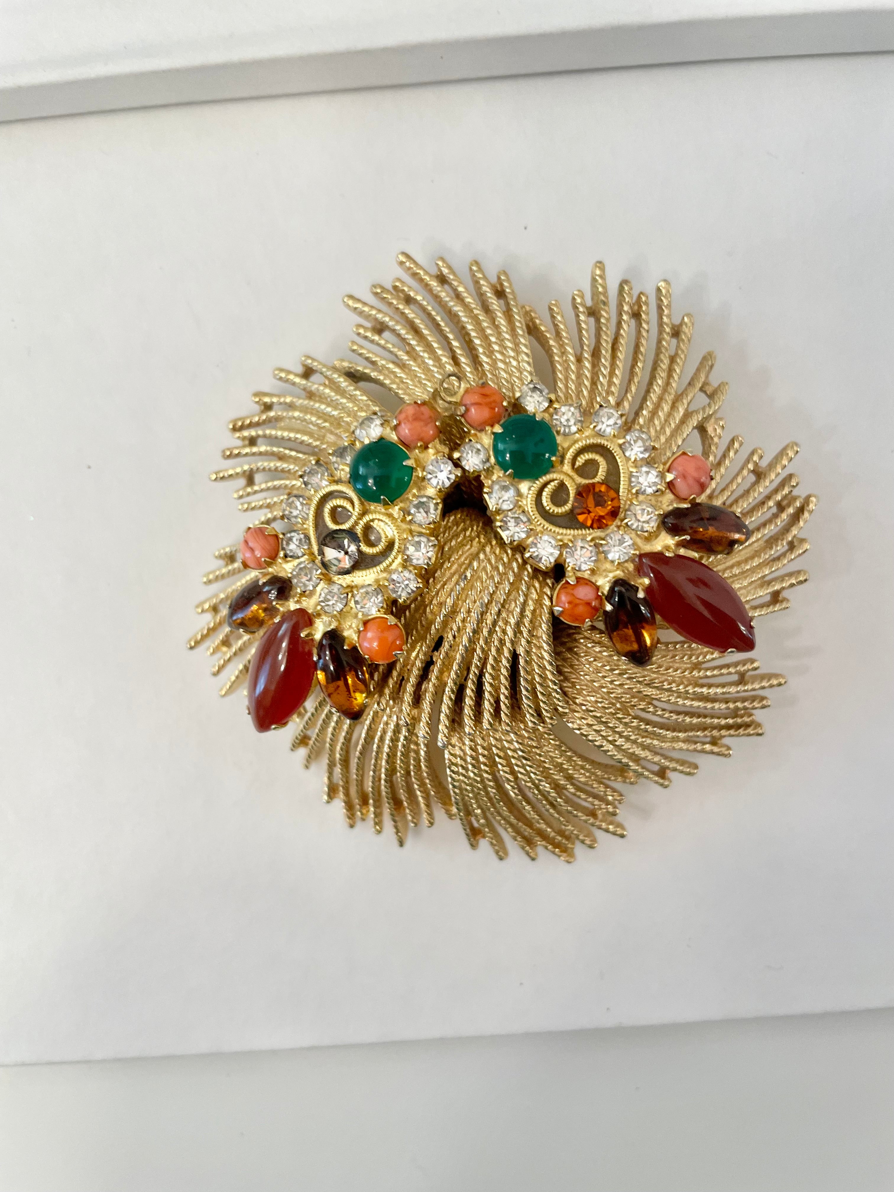 A beautiful rich gold brooch, adorned with the most exquisite color story, coral, green, and carnelian! so chic