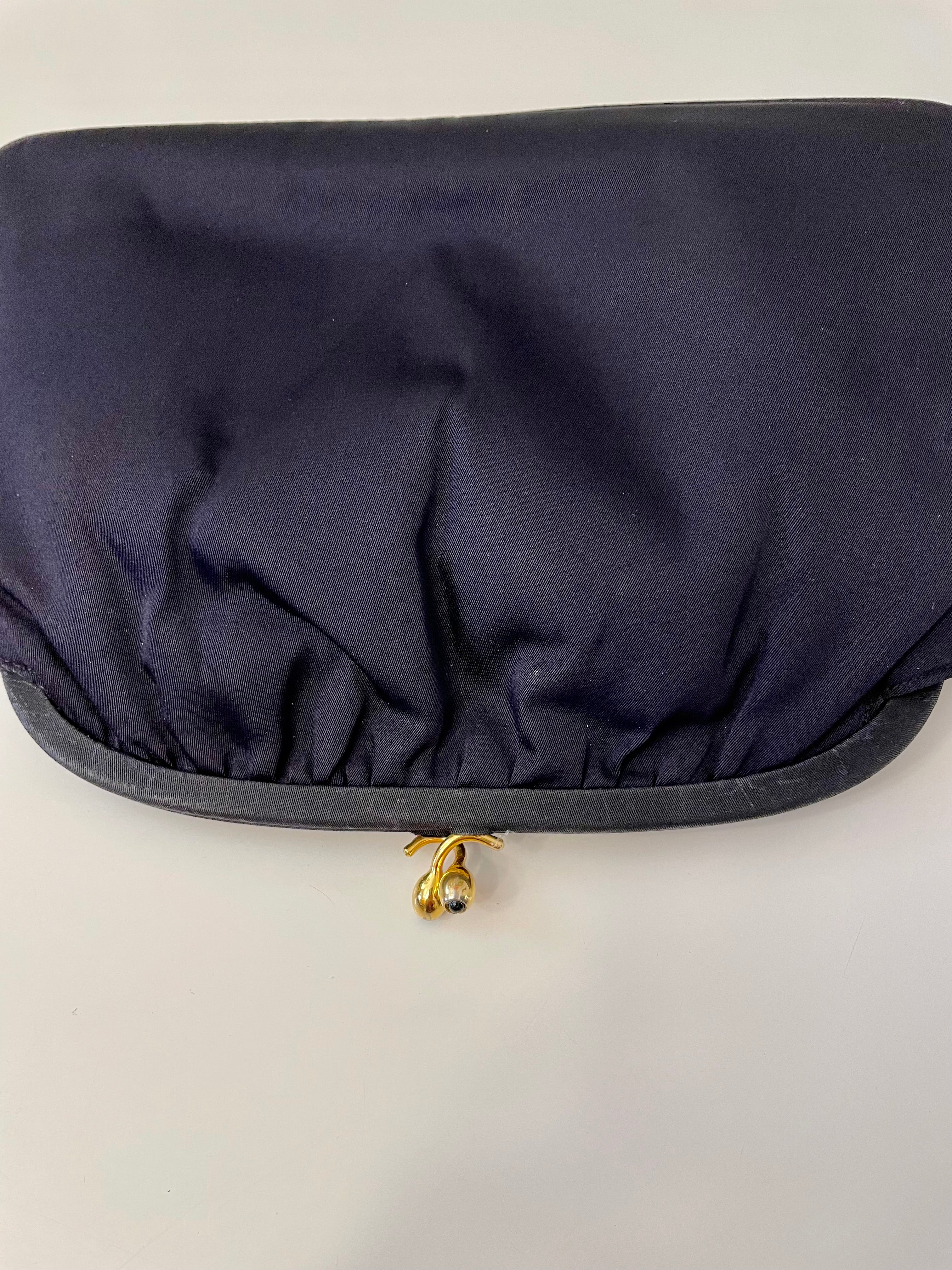 The Socialite and her love of the classic noir satin evening bag... this one is absolutely elegant!