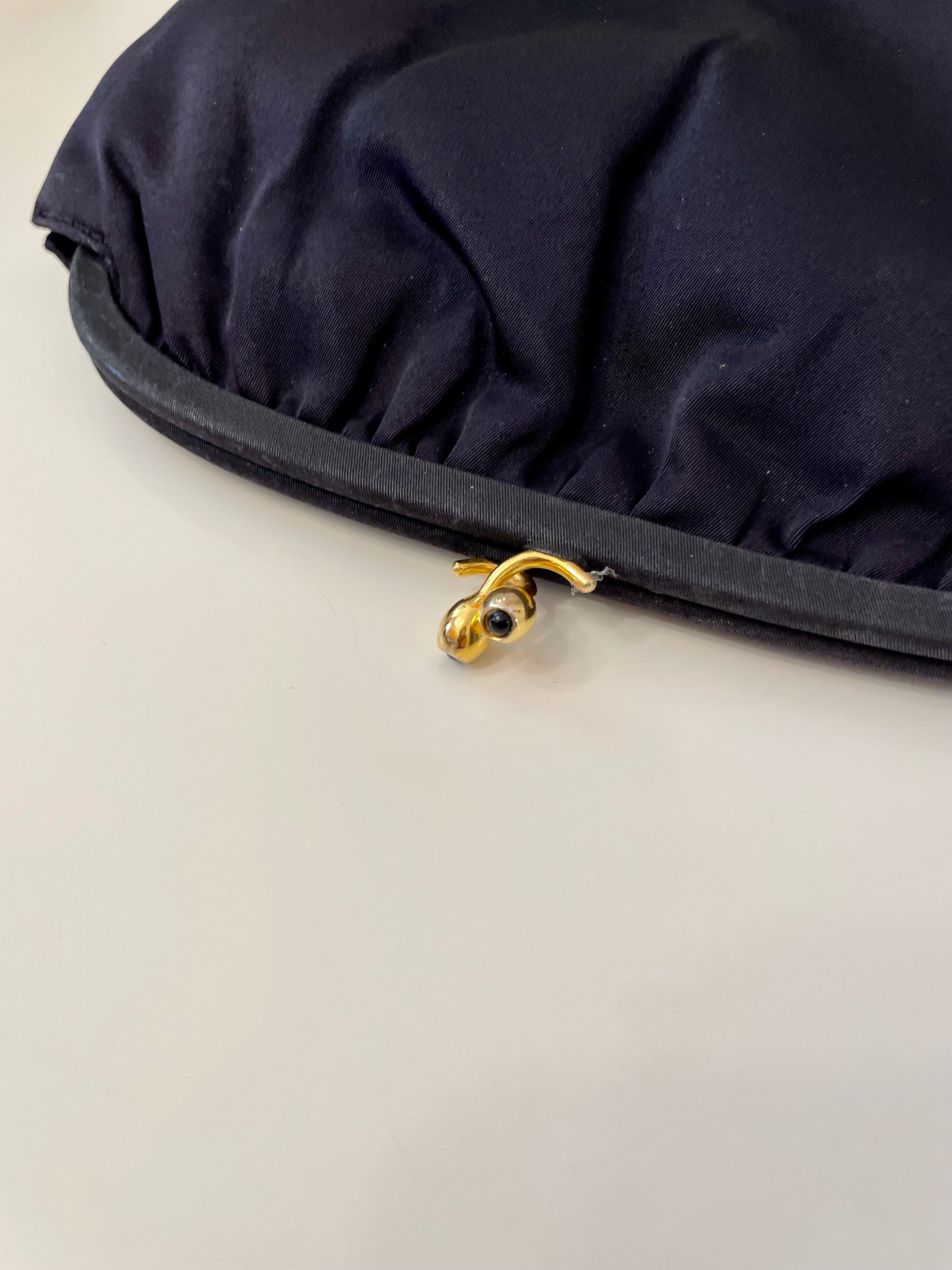 The Socialite and her love of the classic noir satin evening bag... this one is absolutely elegant!