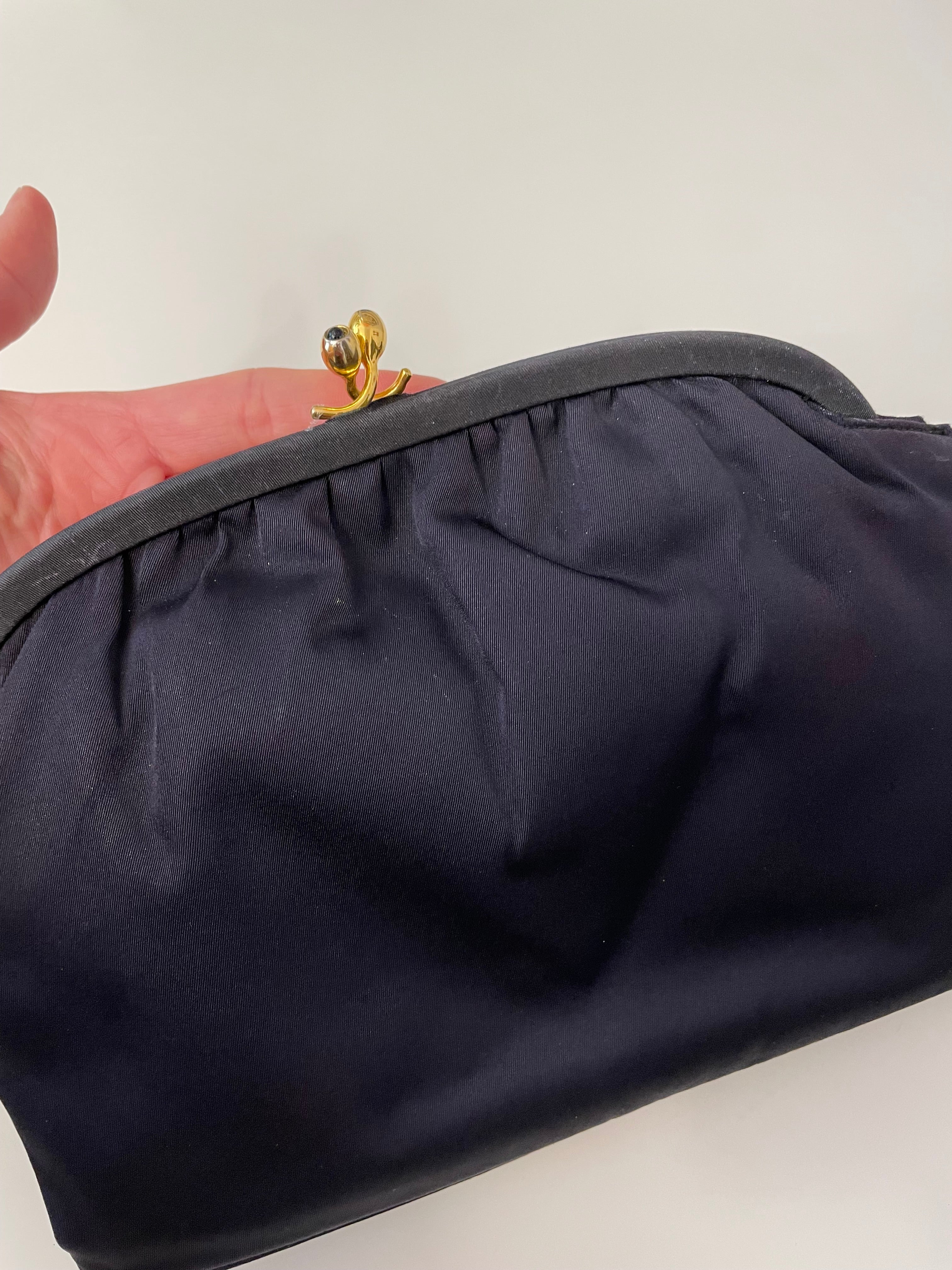 The Socialite and her love of the classic noir satin evening bag... this one is absolutely elegant!