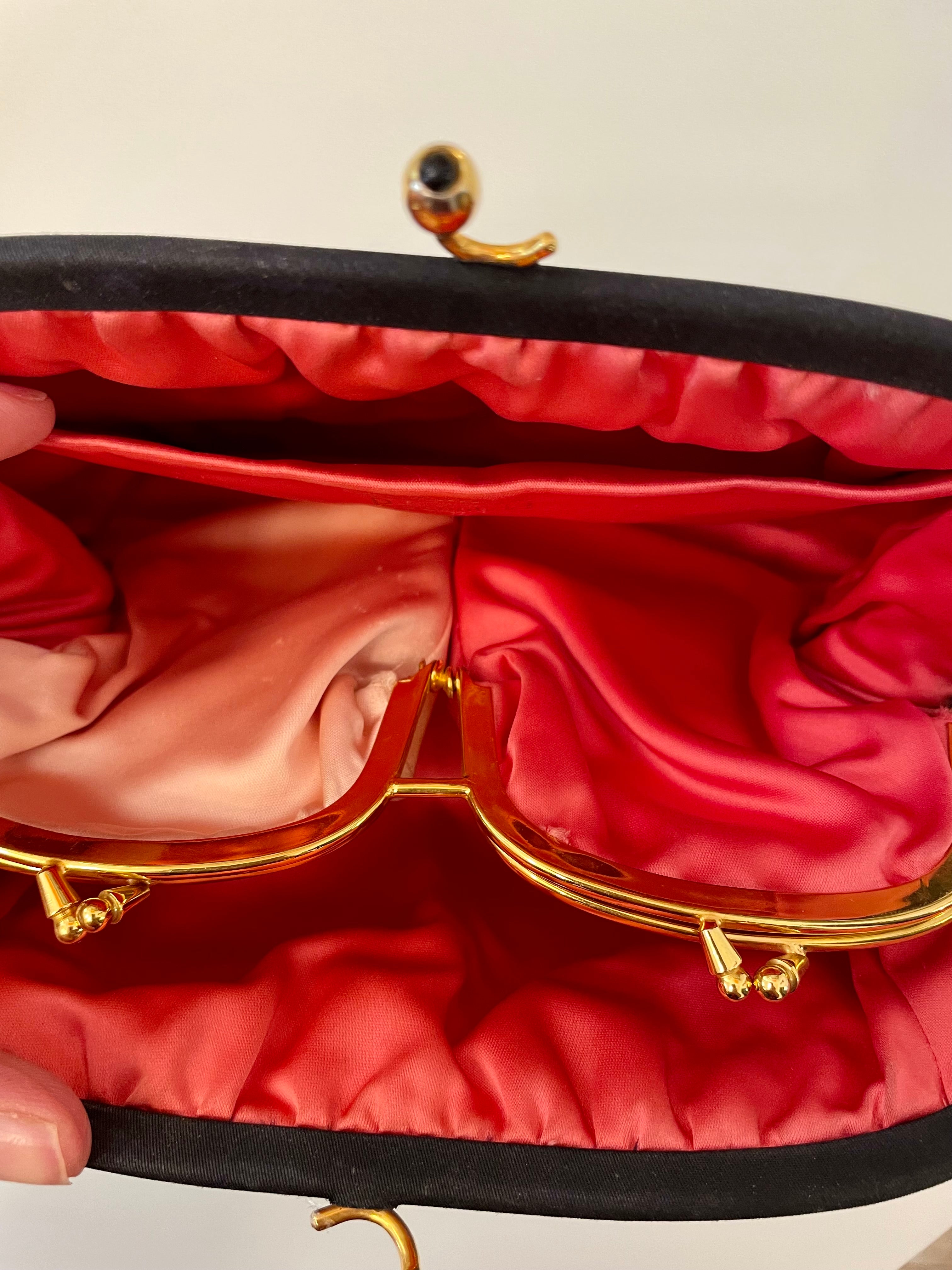 The Socialite and her love of the classic noir satin evening bag... this one is absolutely elegant!
