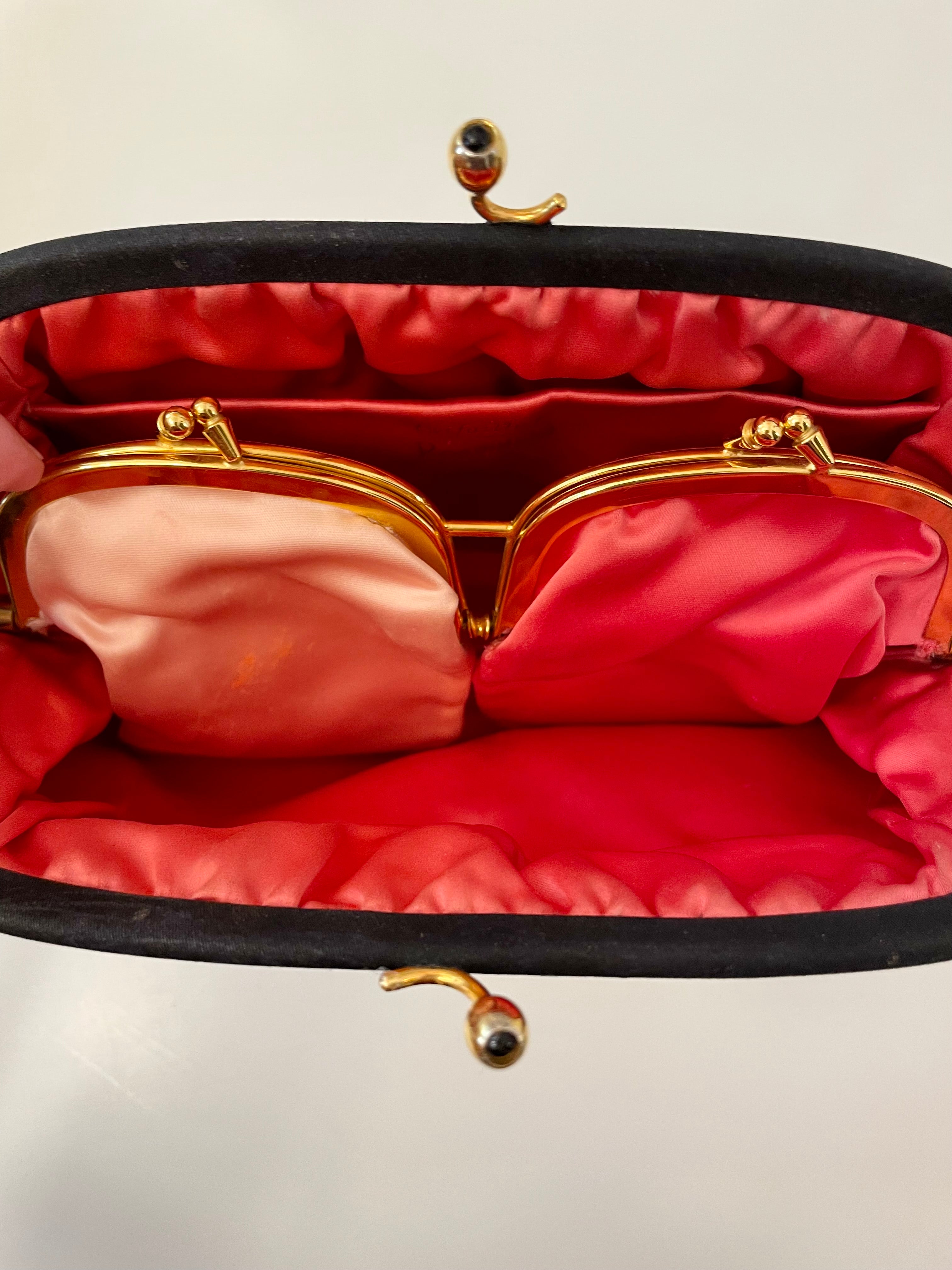 The Socialite and her love of the classic noir satin evening bag... this one is absolutely elegant!