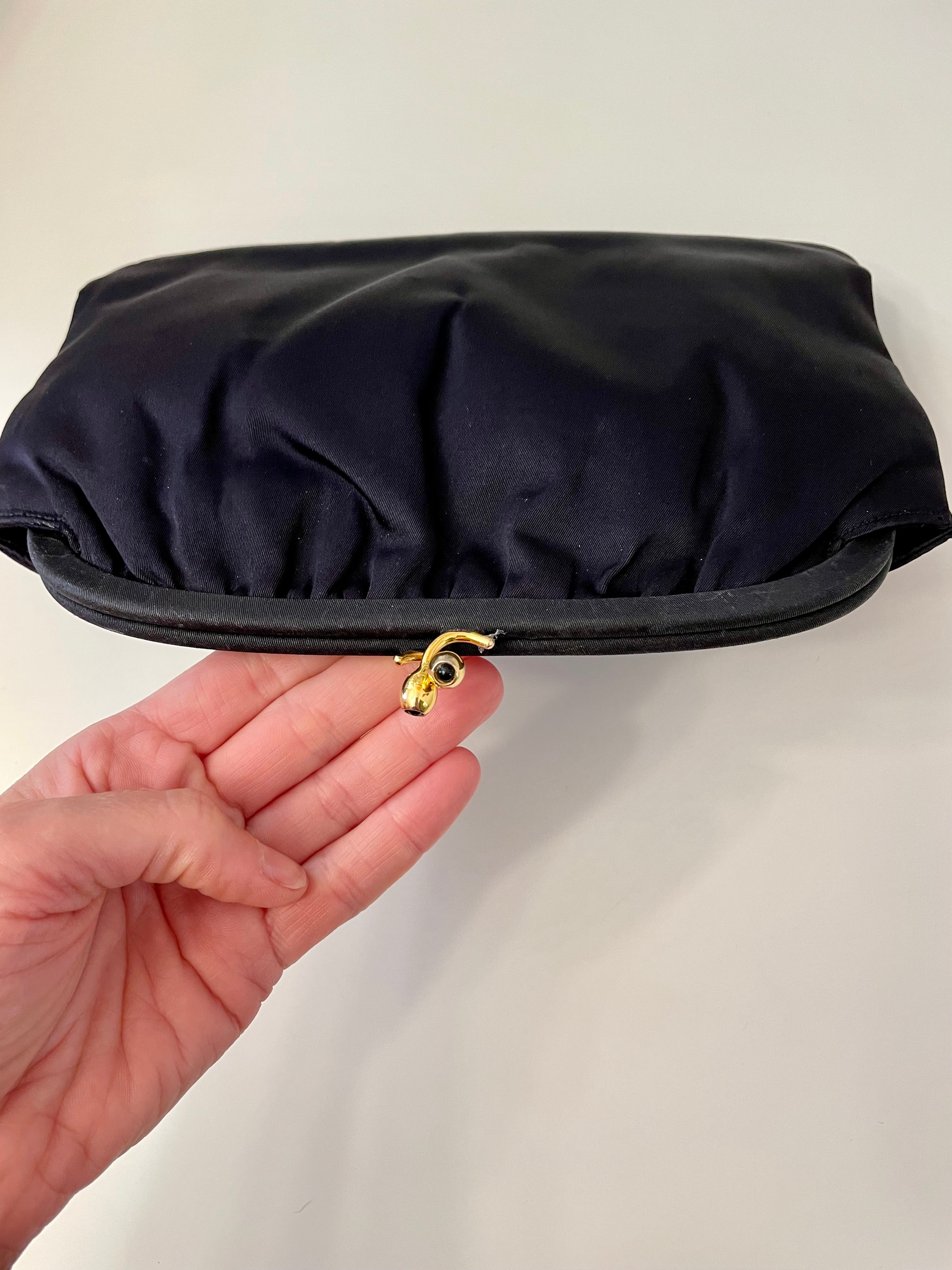 The Socialite and her love of the classic noir satin evening bag... this one is absolutely elegant!