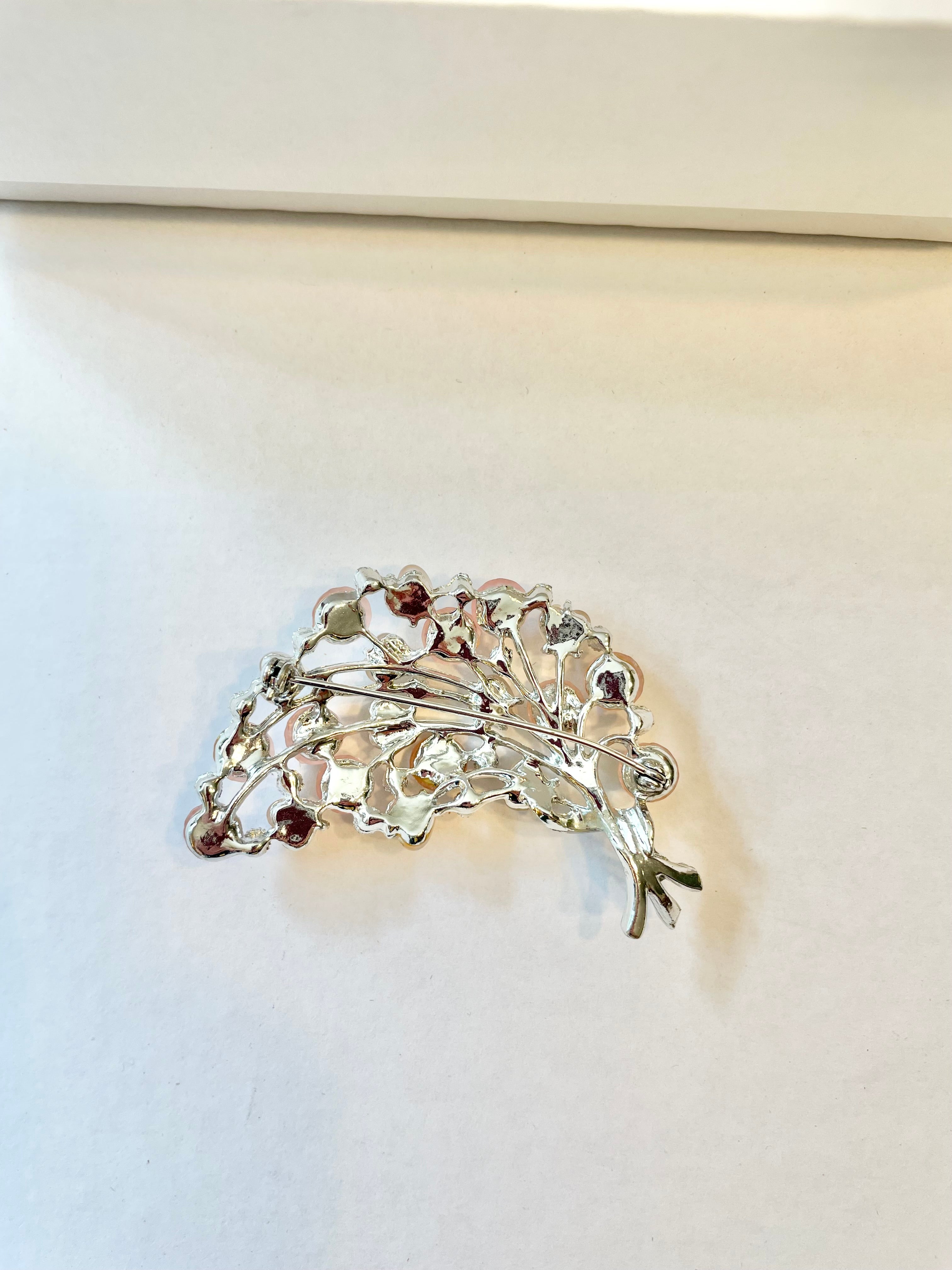 The Flirty gal and her love of all things pink, and blush... a true classy brooch!