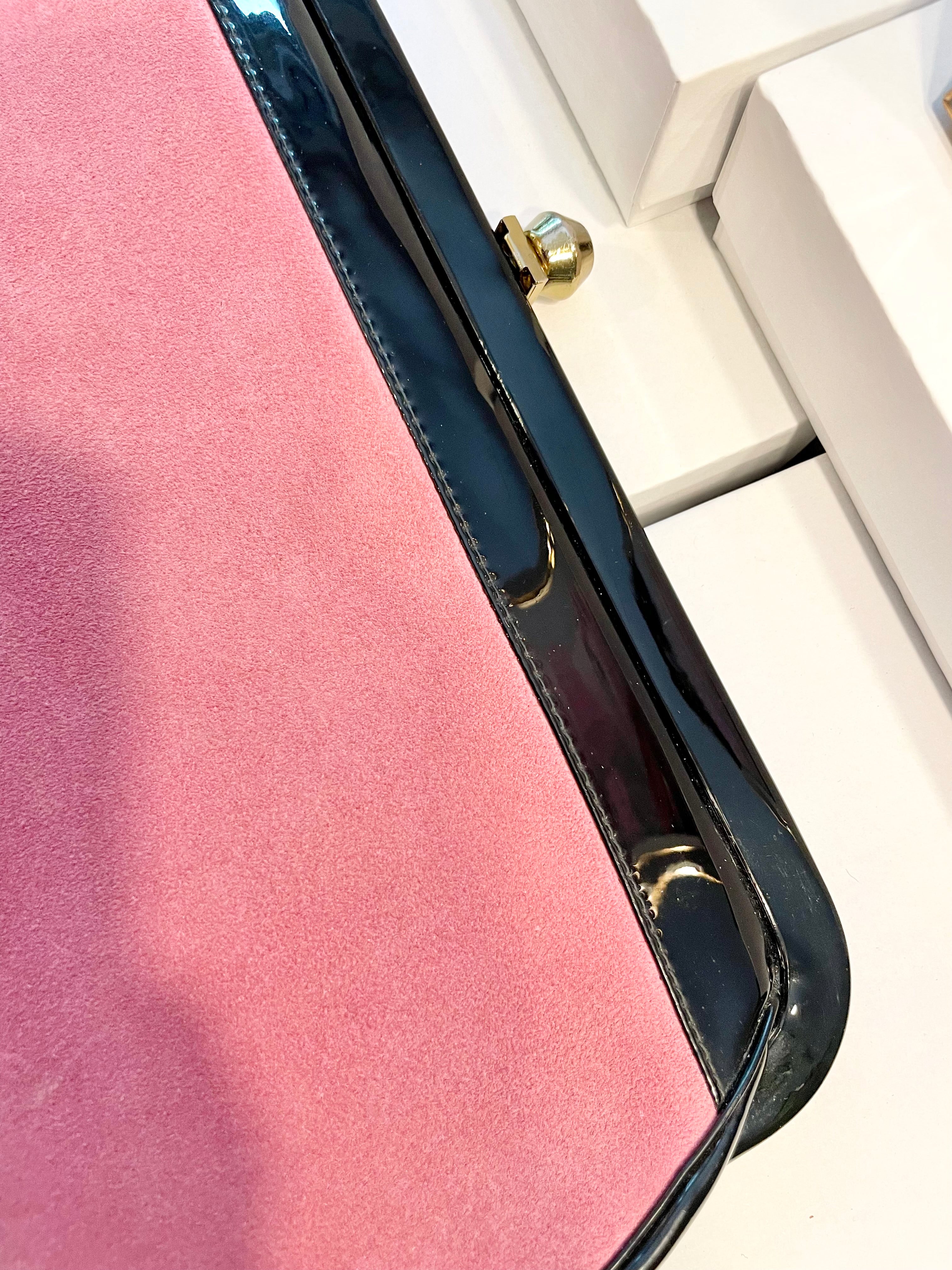 The Flirty Gal loves anything pink... the 1960's extraordinary pink, and black patent leather bag is so brilliant!