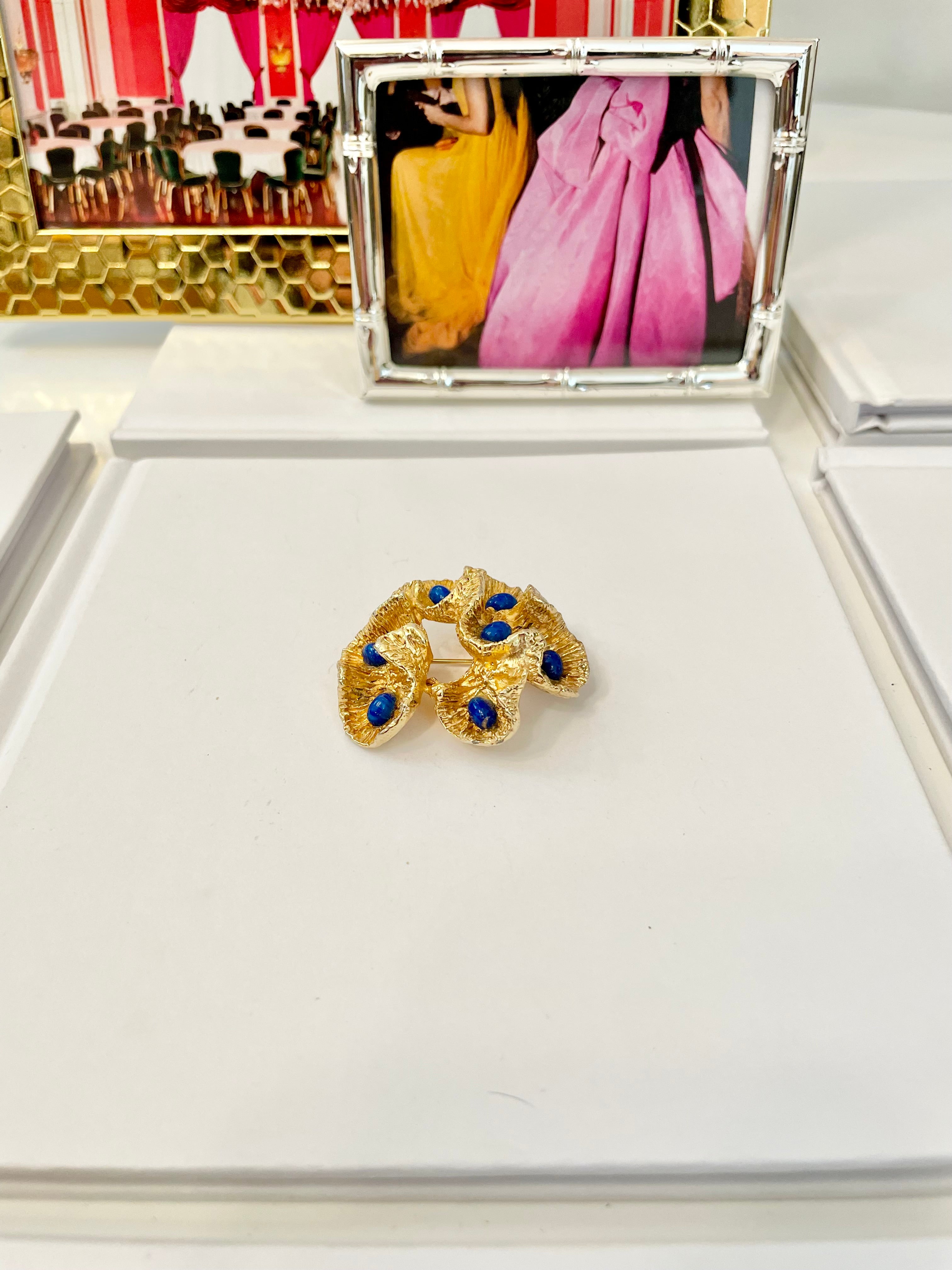 The most chic sculpted gold brooch with faux lapis stones.... so brilliant!