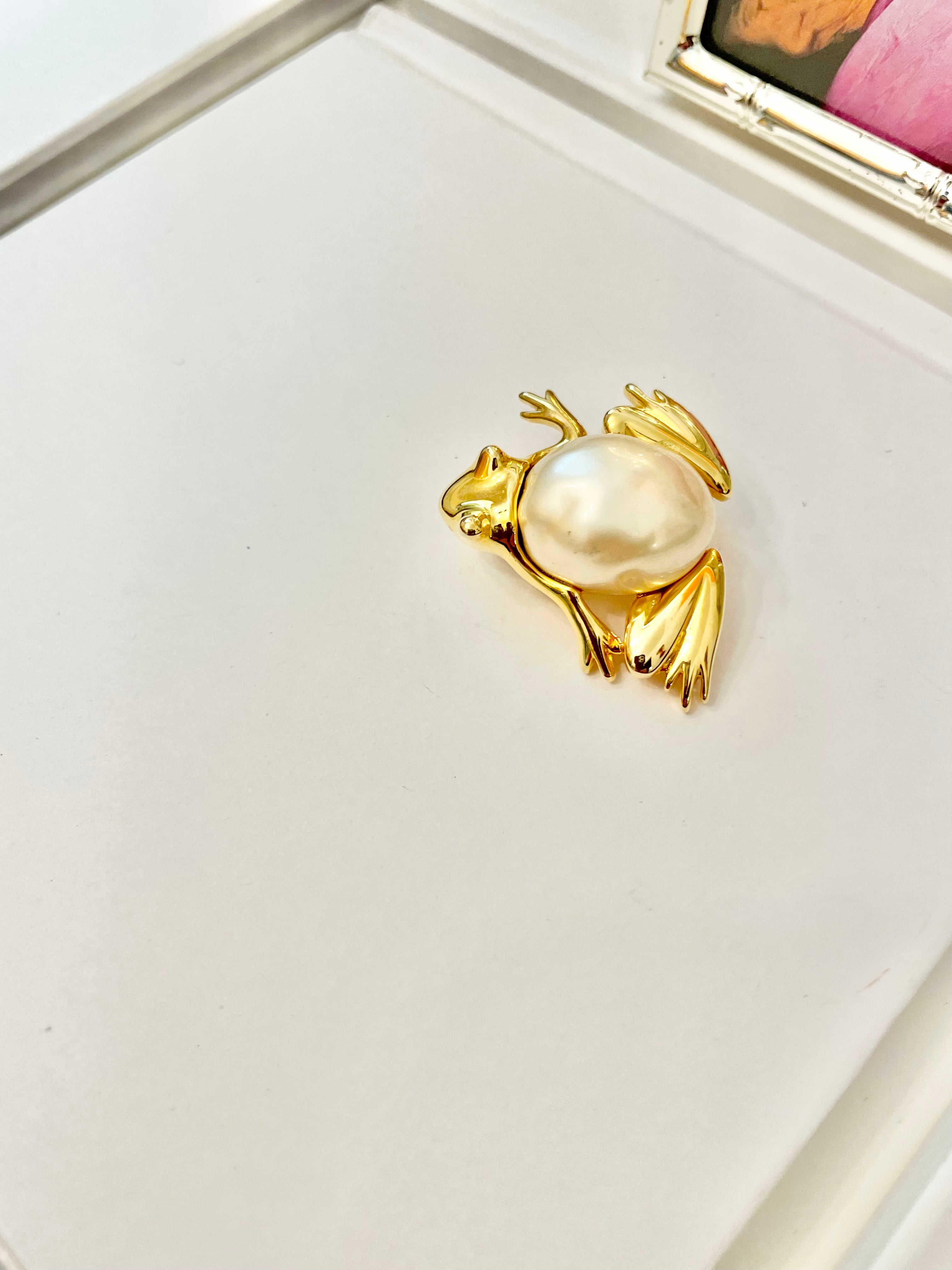 The charming lady loves anything with pearls. This Kenneth Jay lane figural gold brooch is truly divine!