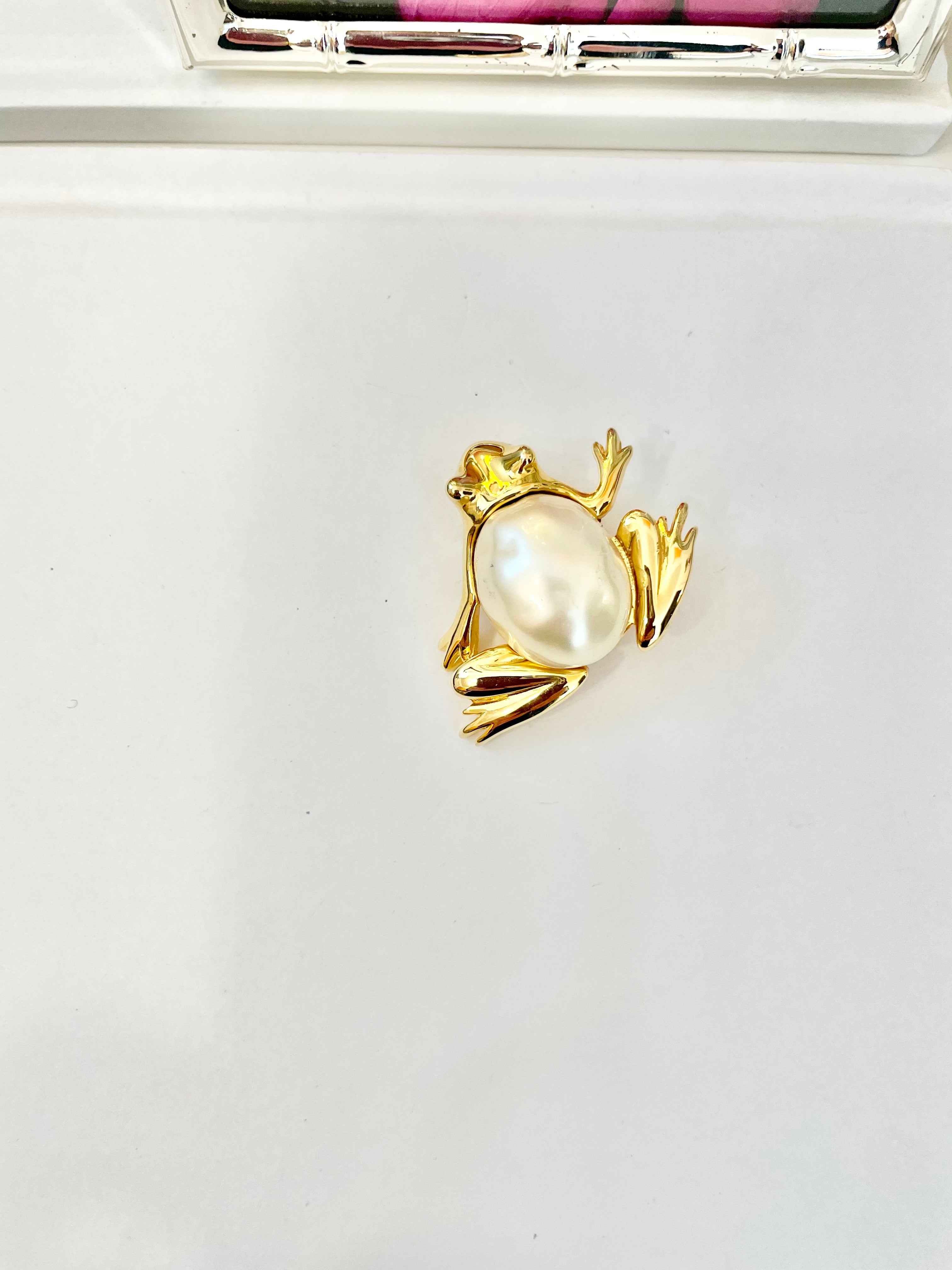 The charming lady loves anything with pearls. This Kenneth Jay lane figural gold brooch is truly divine!