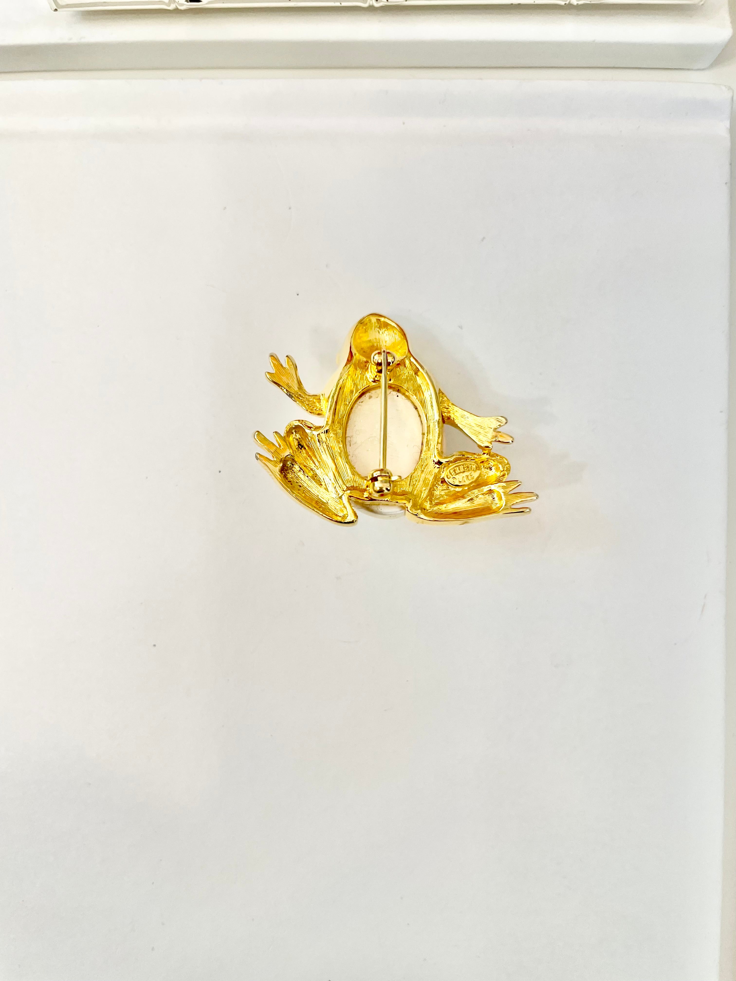 The charming lady loves anything with pearls. This Kenneth Jay lane figural gold brooch is truly divine!