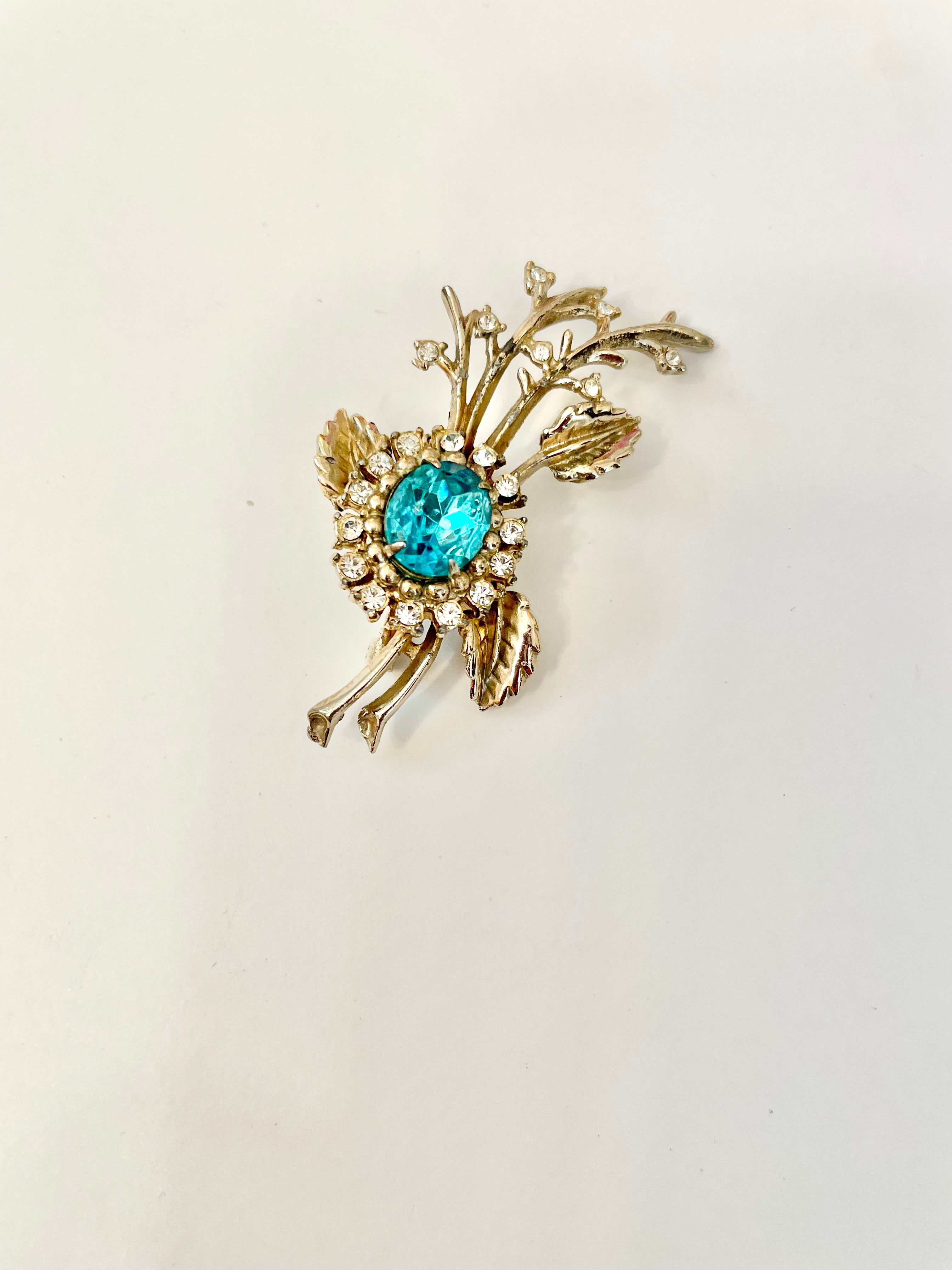 The happy hostess loves a colorful brooch... oh so divine!