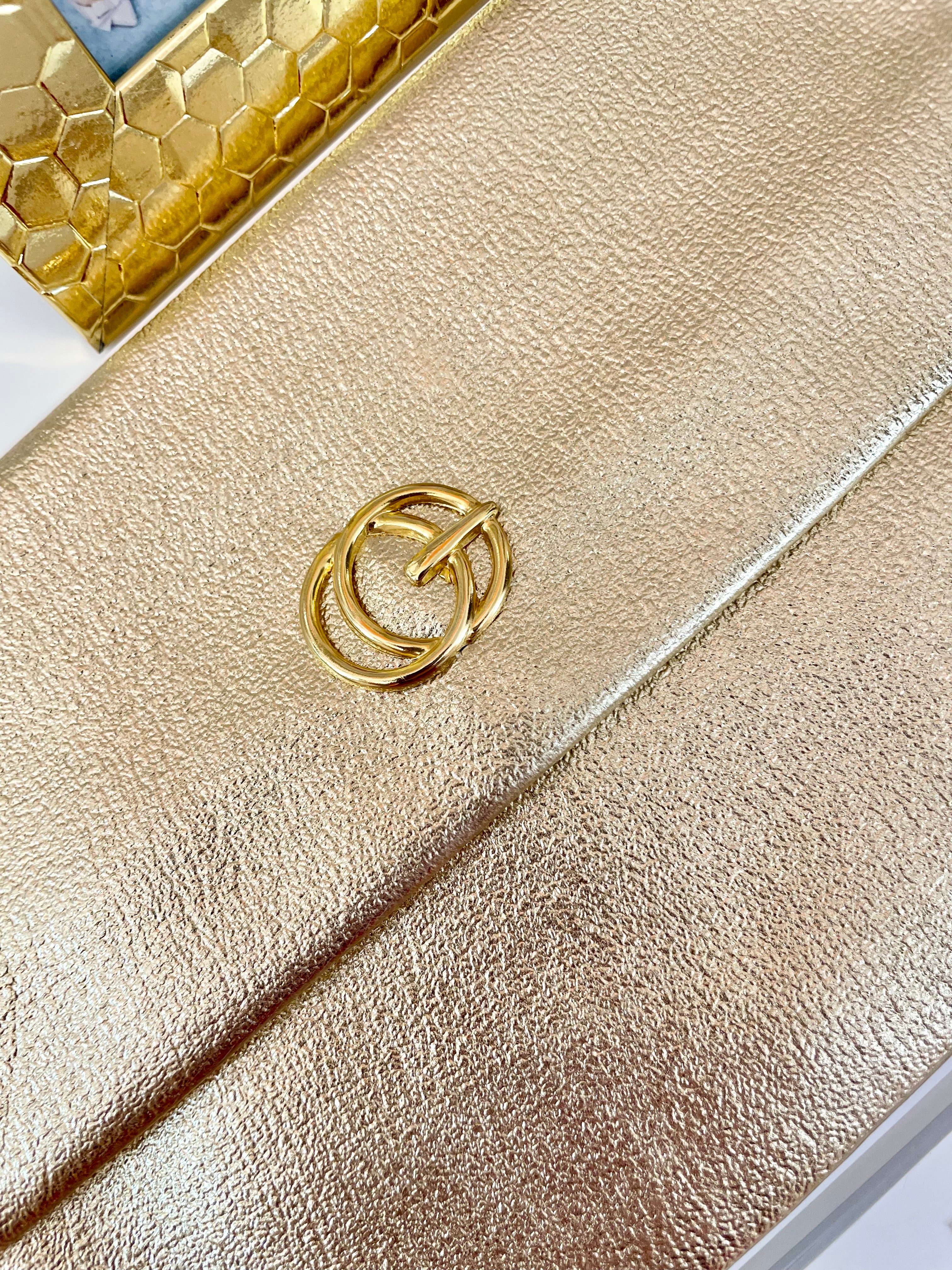 1960's sassy petite gold clutch bag with lovely gold adornment...