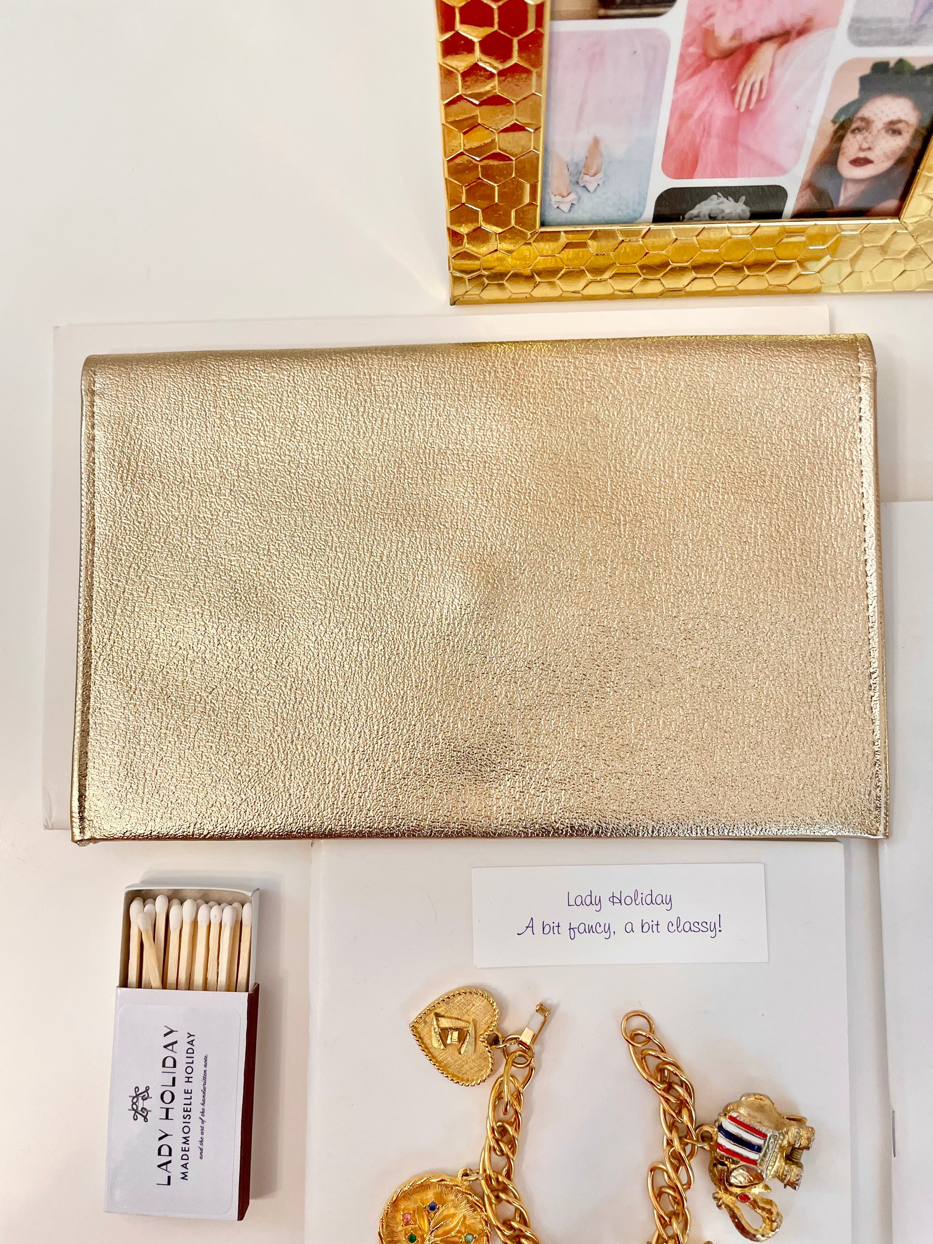 1960's sassy petite gold clutch bag with lovely gold adornment...