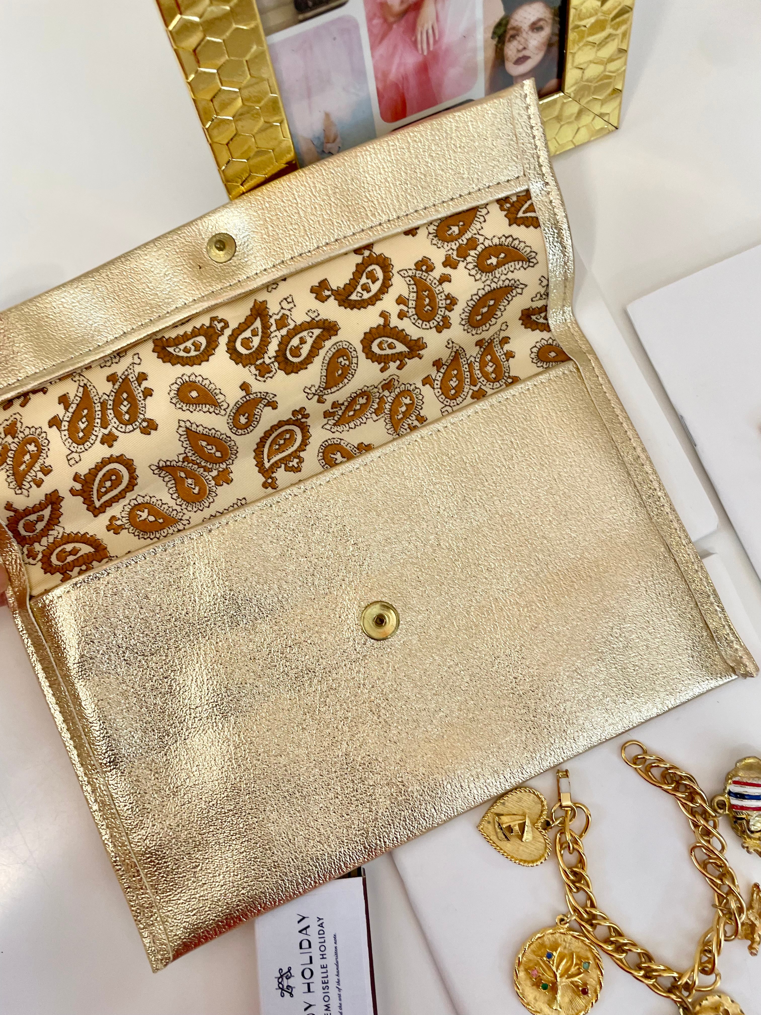 1960's sassy petite gold clutch bag with lovely gold adornment...