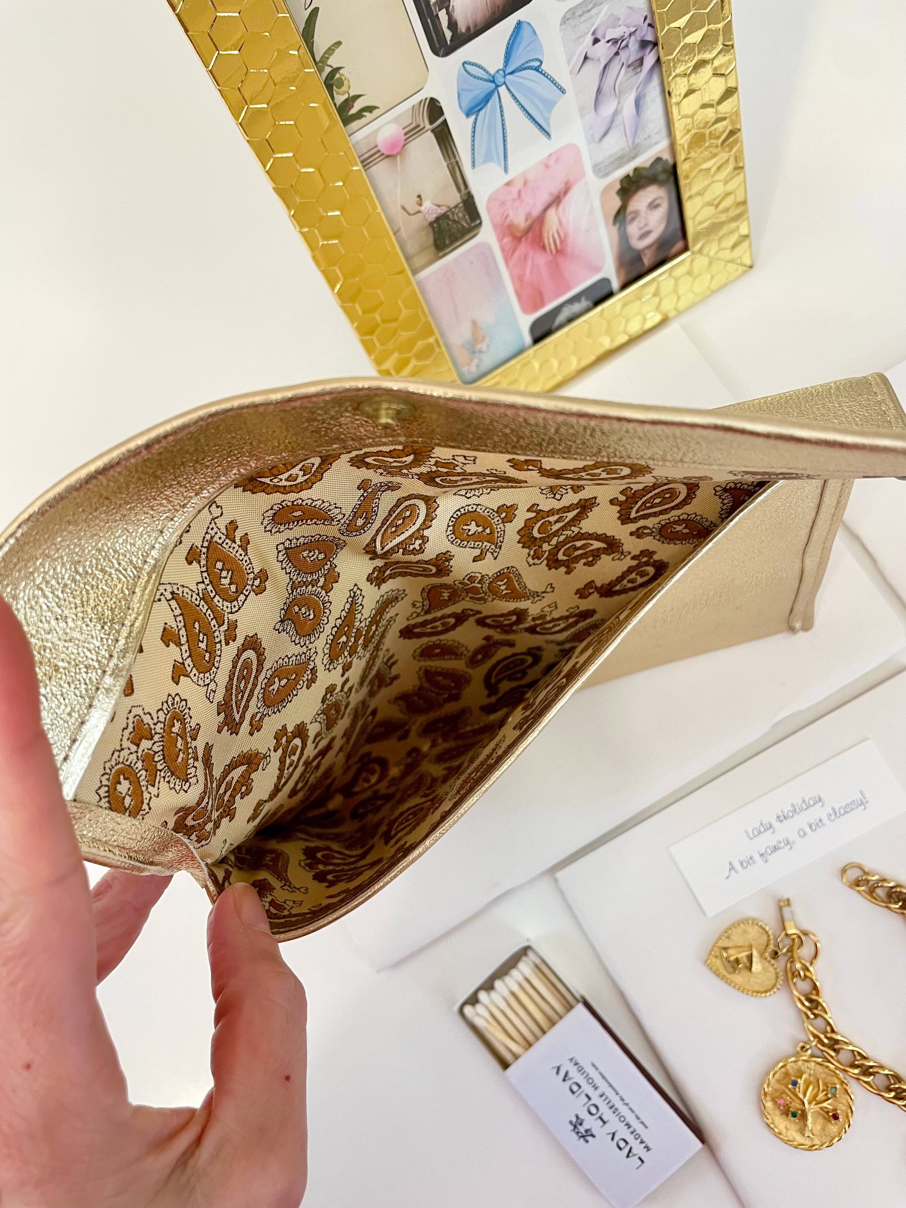 1960's sassy petite gold clutch bag with lovely gold adornment...