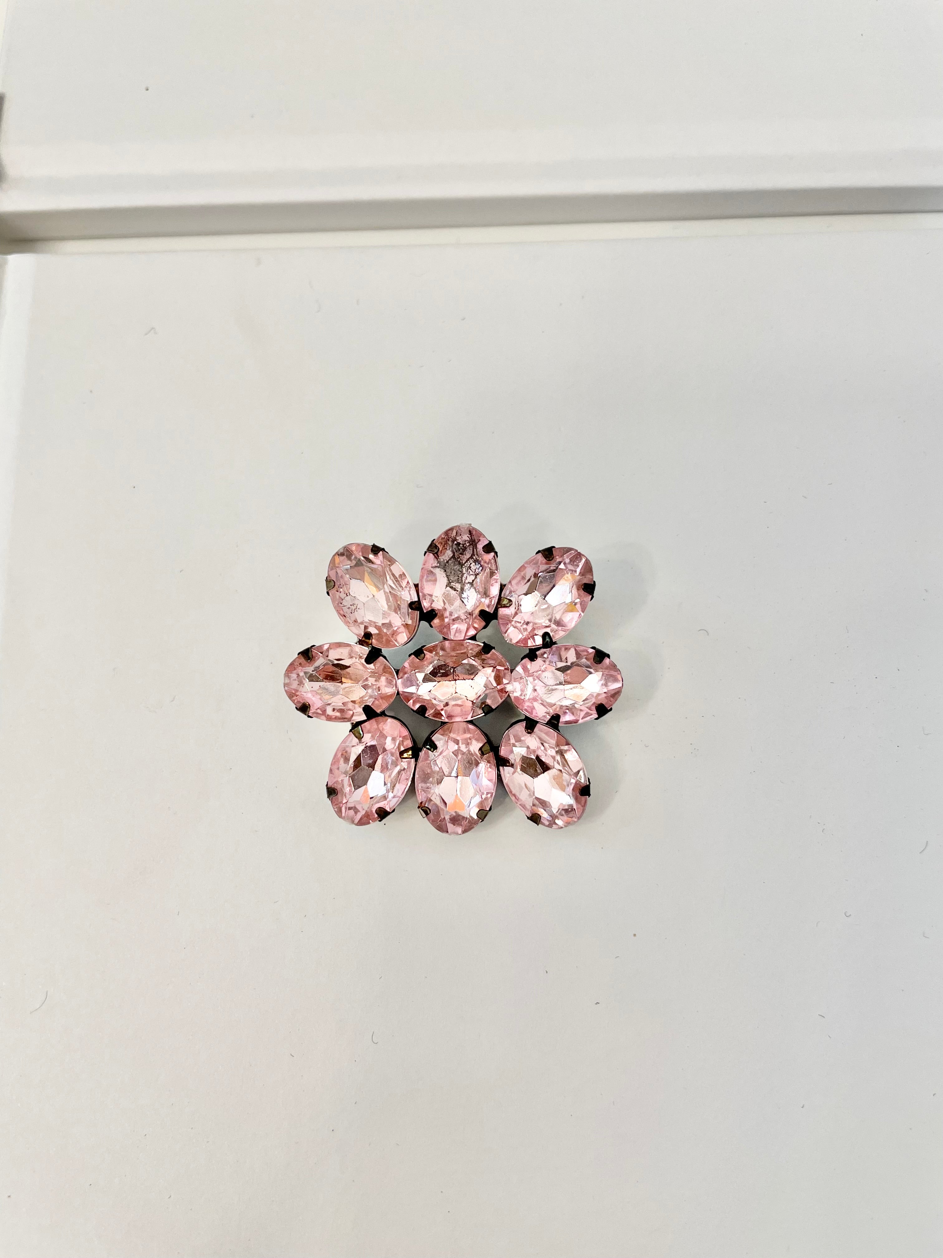 The Flirty gal and her love a pretty pink brooch. This 1980's divine brooch is pure perfection1