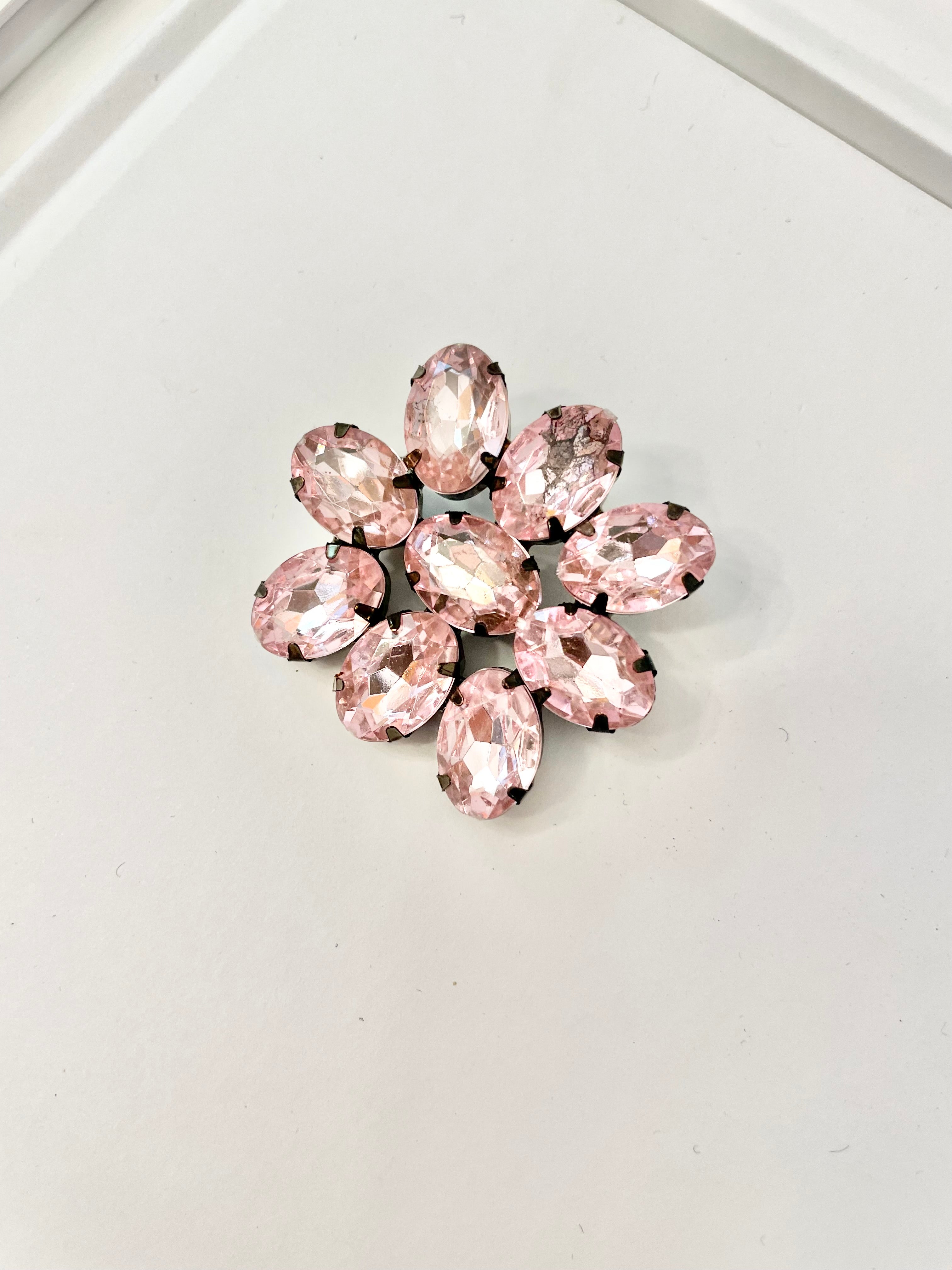 The Flirty gal and her love a pretty pink brooch. This 1980's divine brooch is pure perfection1