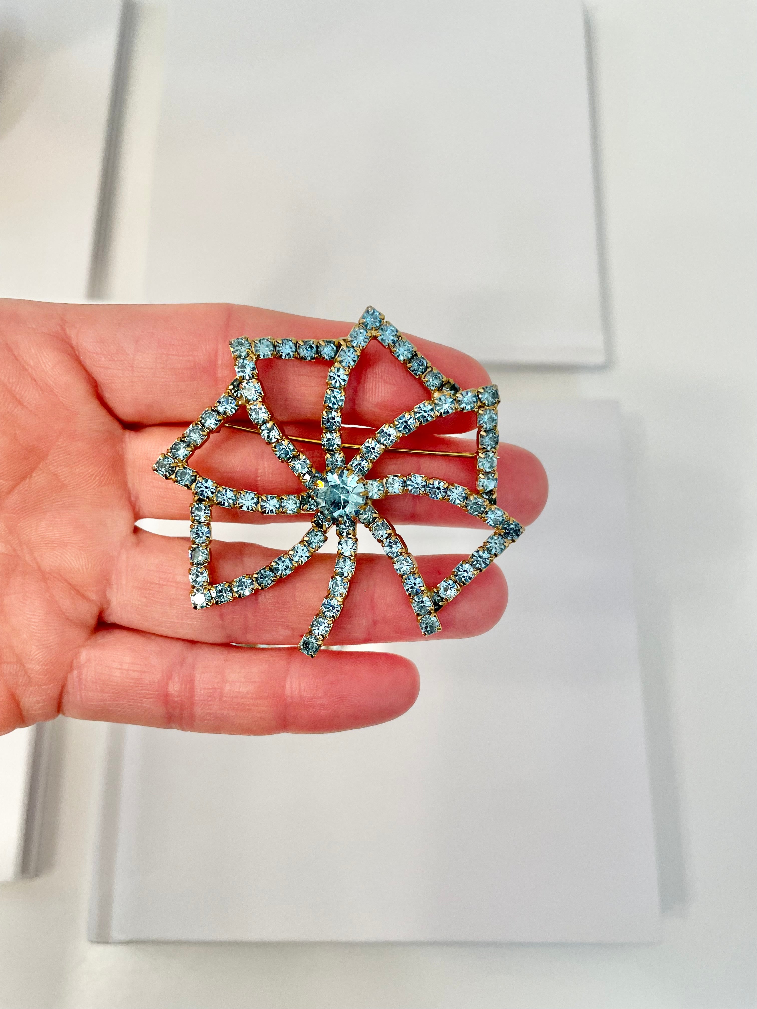 1960's Heiress and her love of a classy brooch set. This aqua glass brooch and earrings are truly divine.