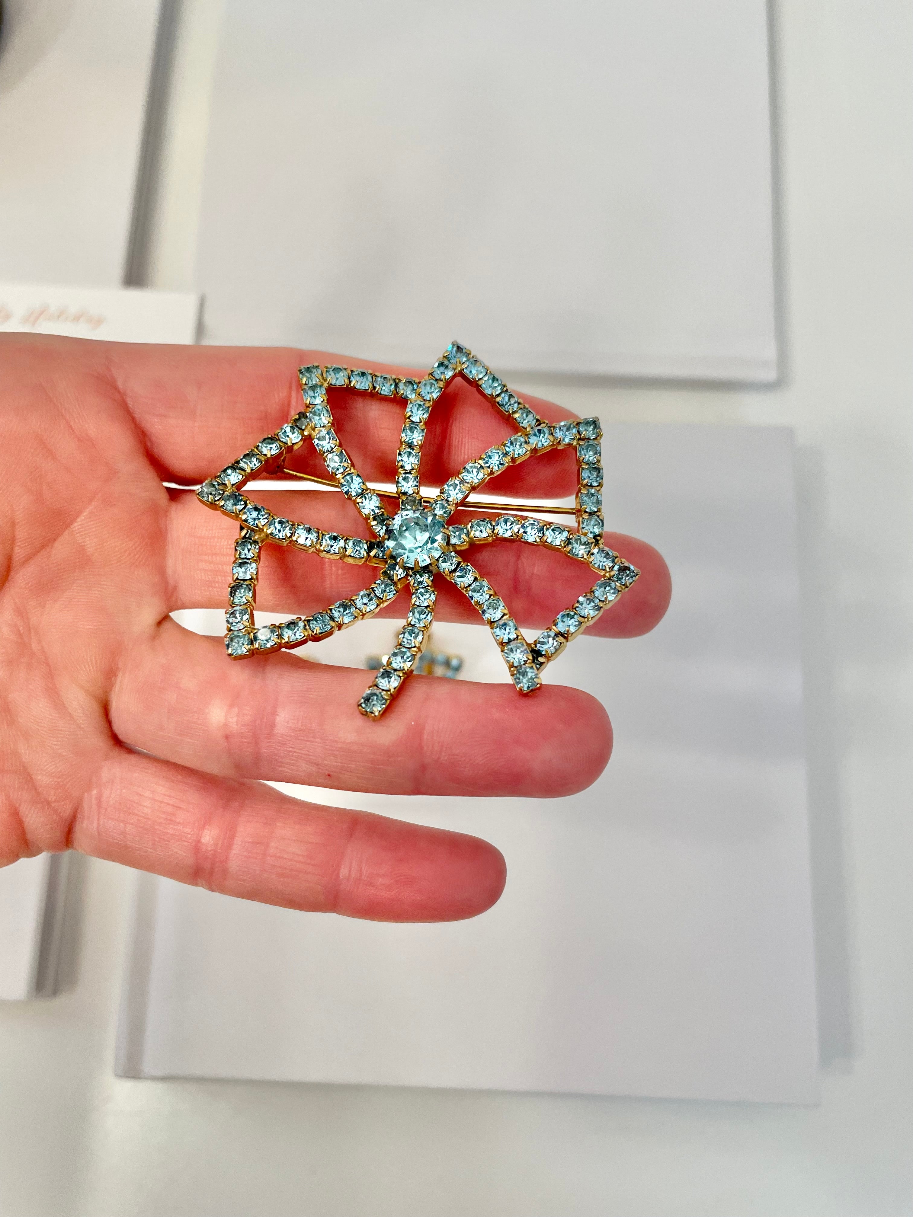 1960's Heiress and her love of a classy brooch set. This aqua glass brooch and earrings are truly divine.