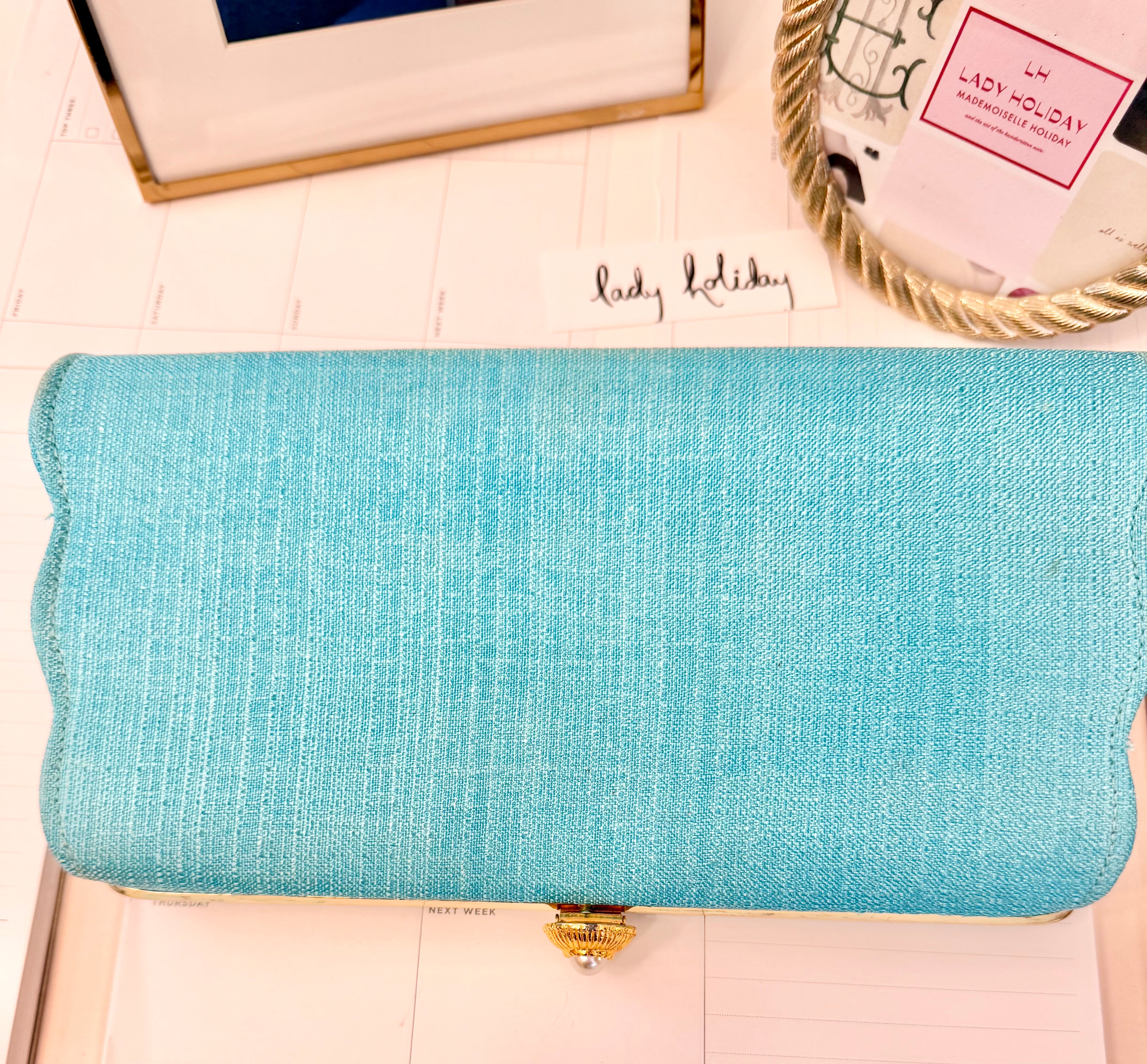 1960's super chic aqua clutch bag adorned with pearl closure... so lovely.