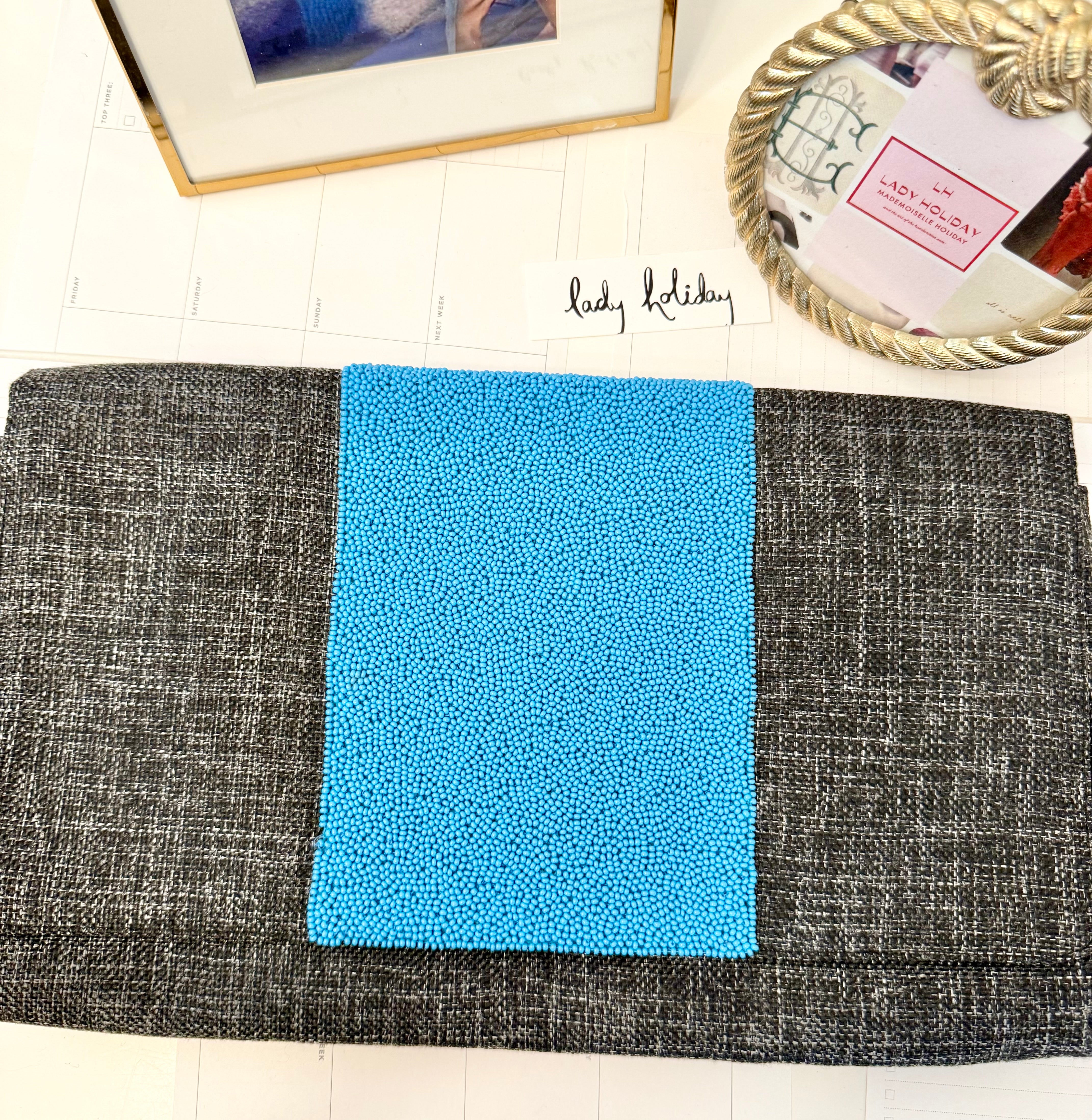 The most classy summery linen clutch adorned with blue glass beads... so feminine!