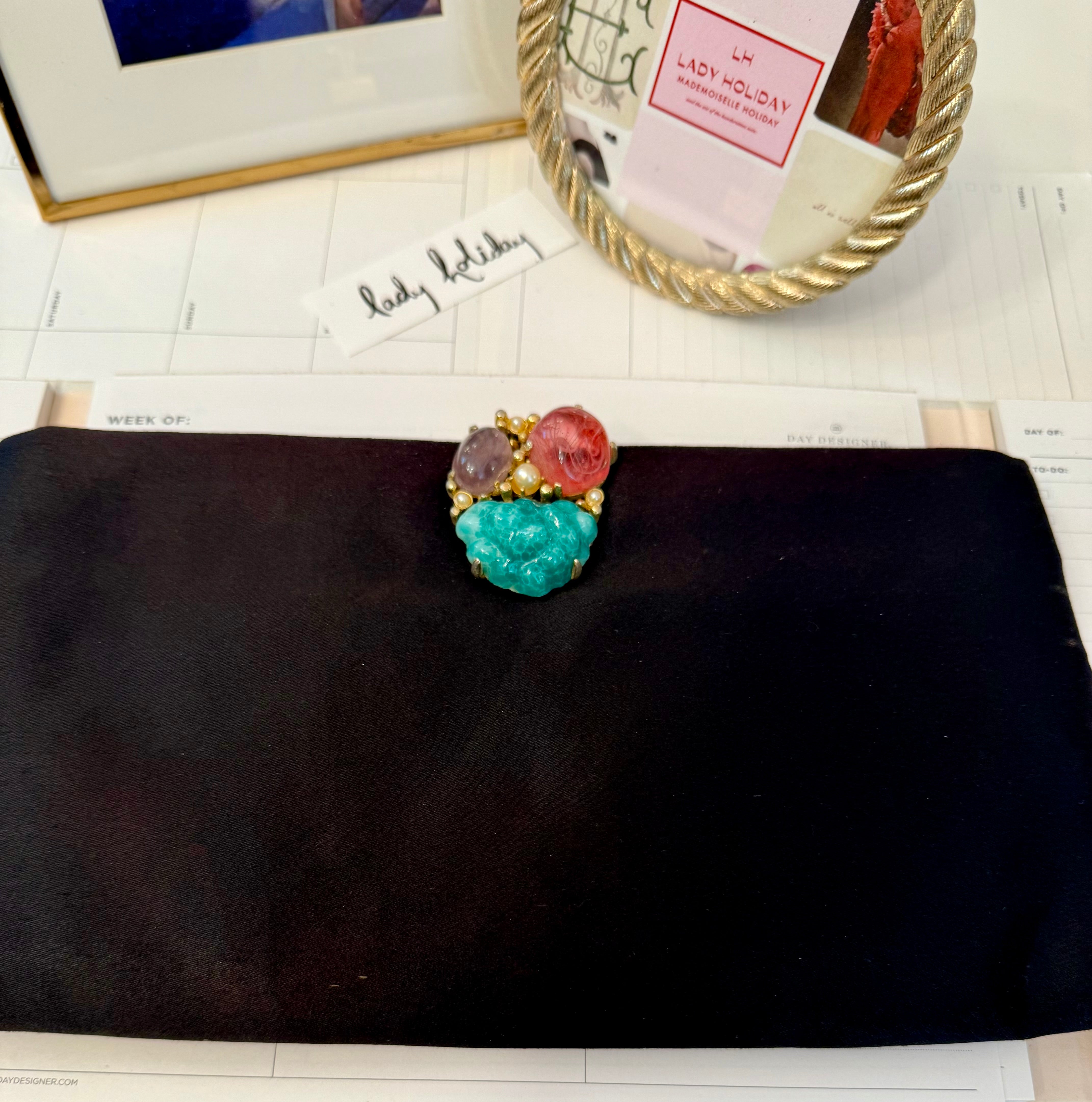 The most chic black satin evening bag with the most divine adornment.