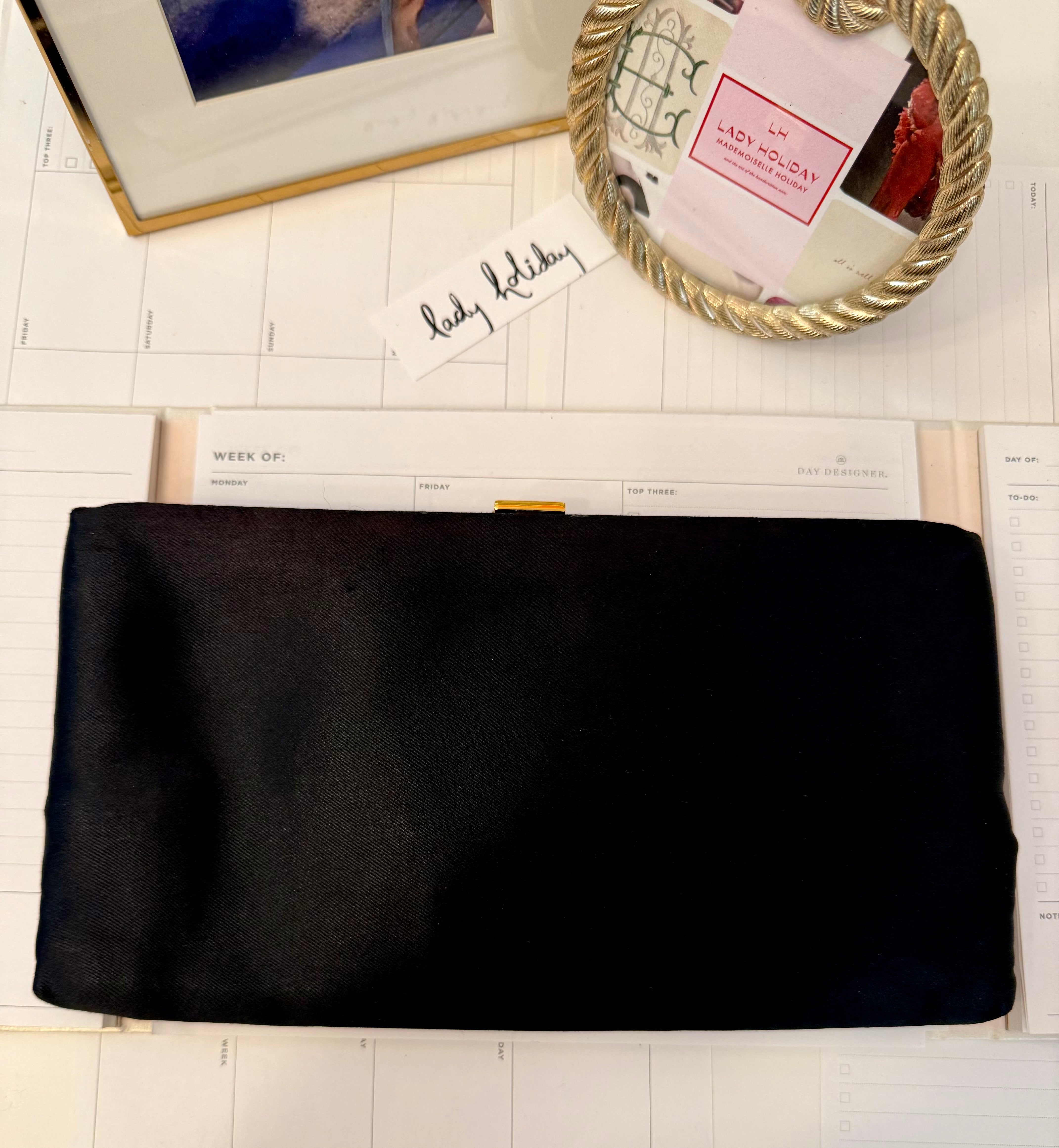 The most chic black satin evening bag with the most divine adornment.